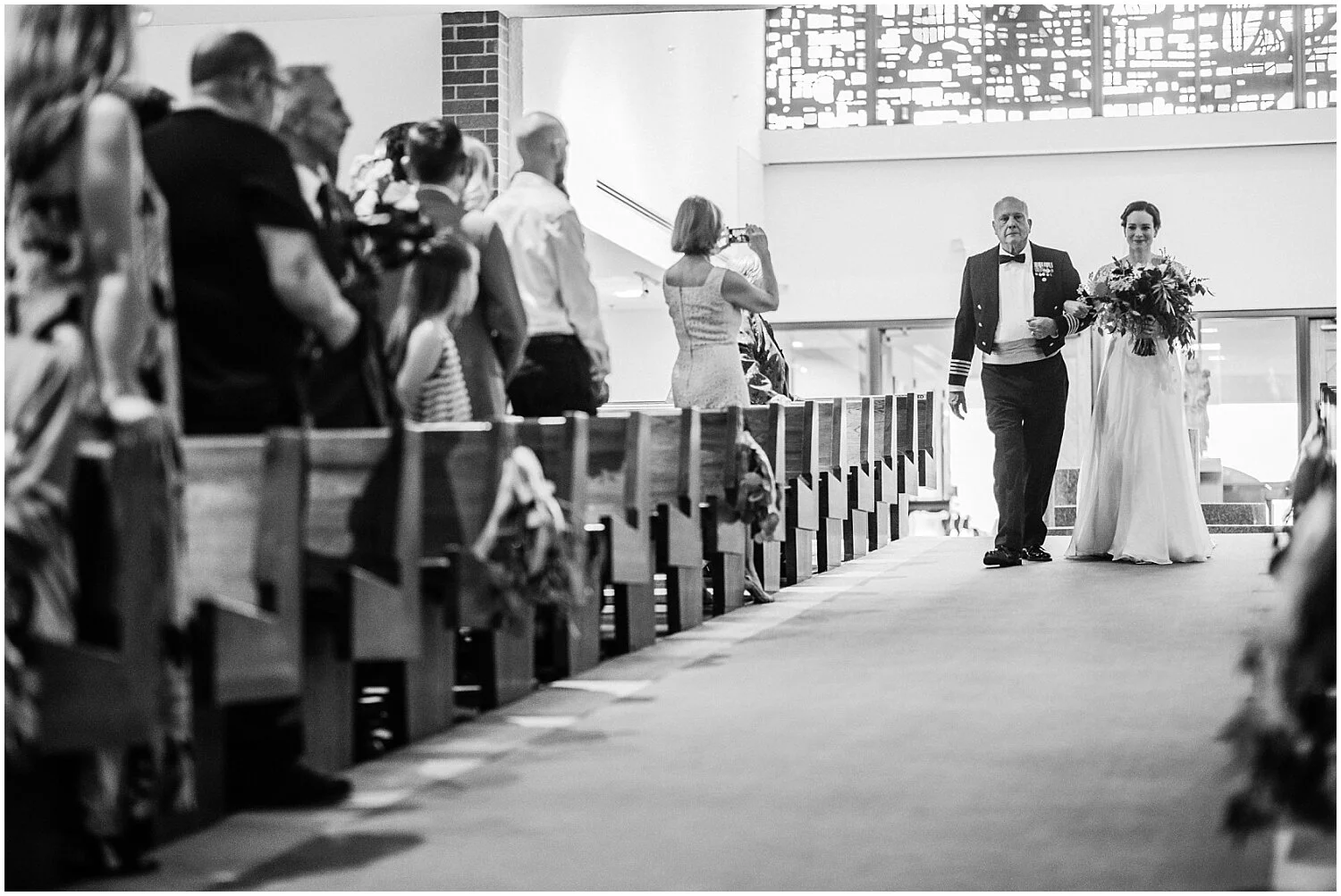 bride walking down the aisle in wedding ceremony