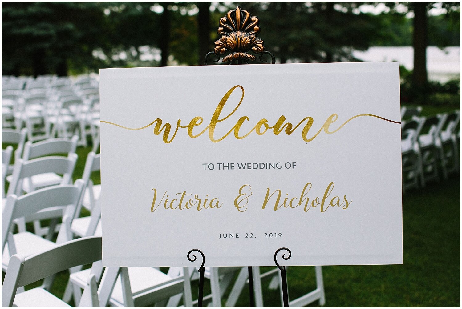  white and gold font welcome sign for the ceremony 