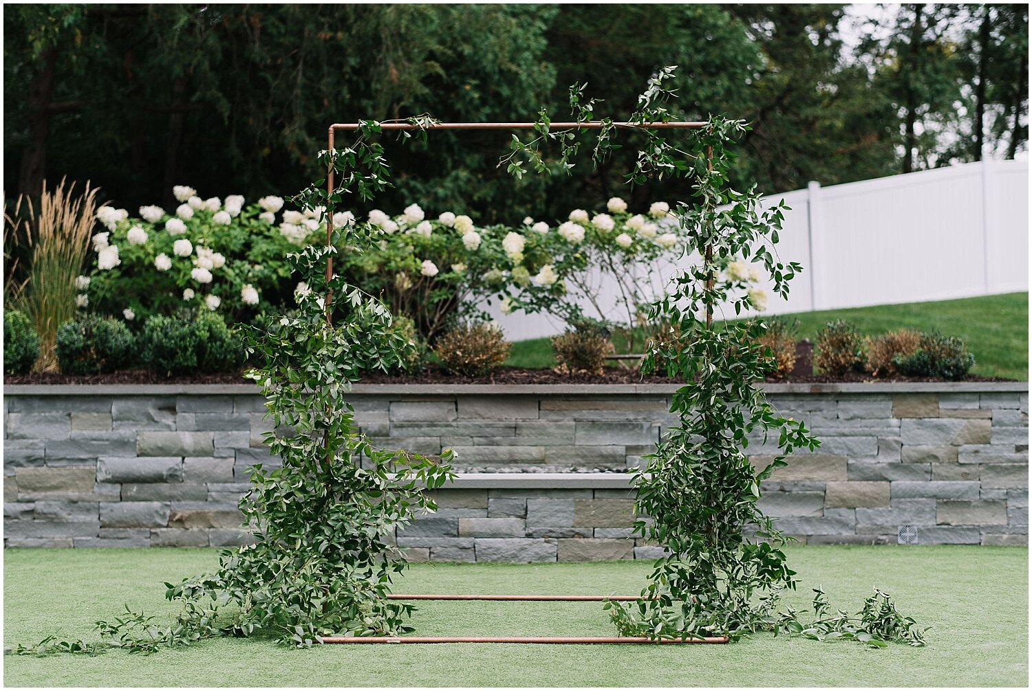  greenery and white wedding arch 