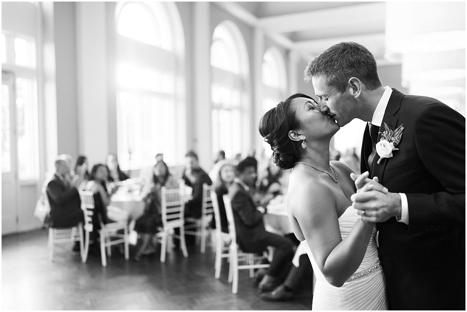  bride and groom kiss during their first dance 