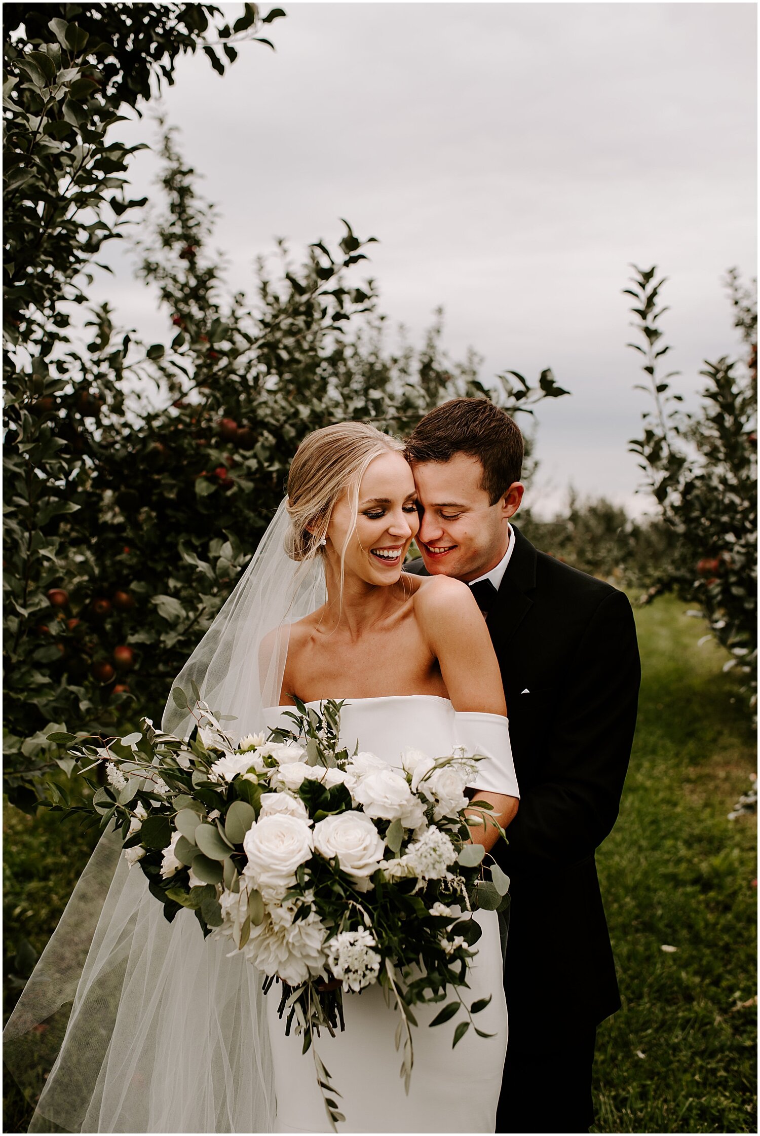  bride and groom smiling during their shoot 