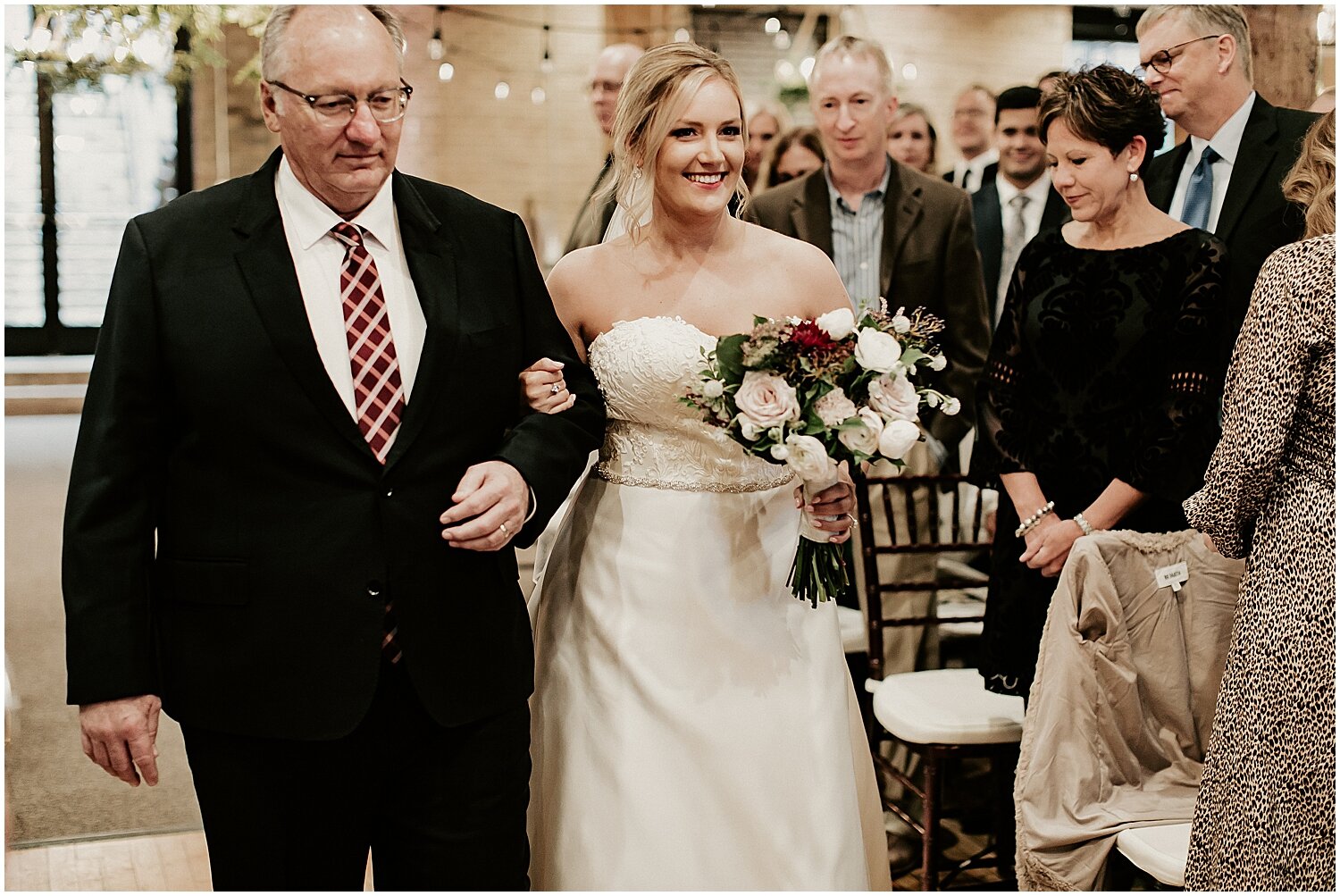  bride and her father walking down the aisle 