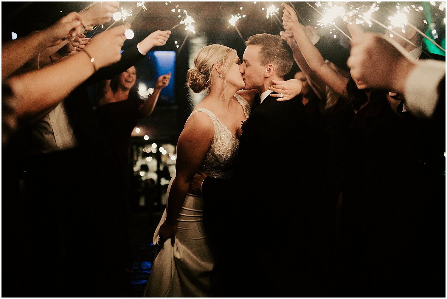  bride and groom at their grand entrance with sparklers 