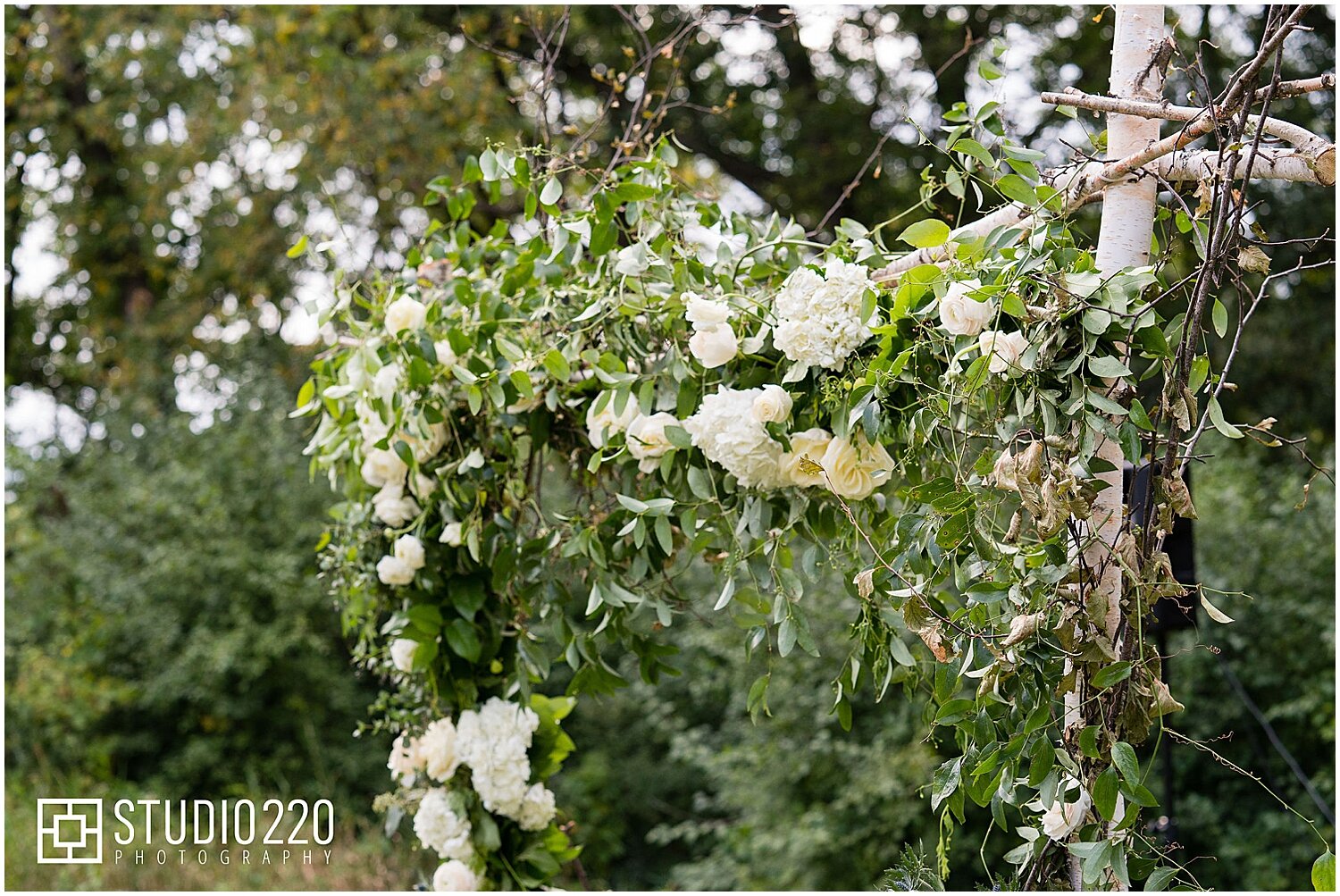 Greenery with white flowers for wedding arch 