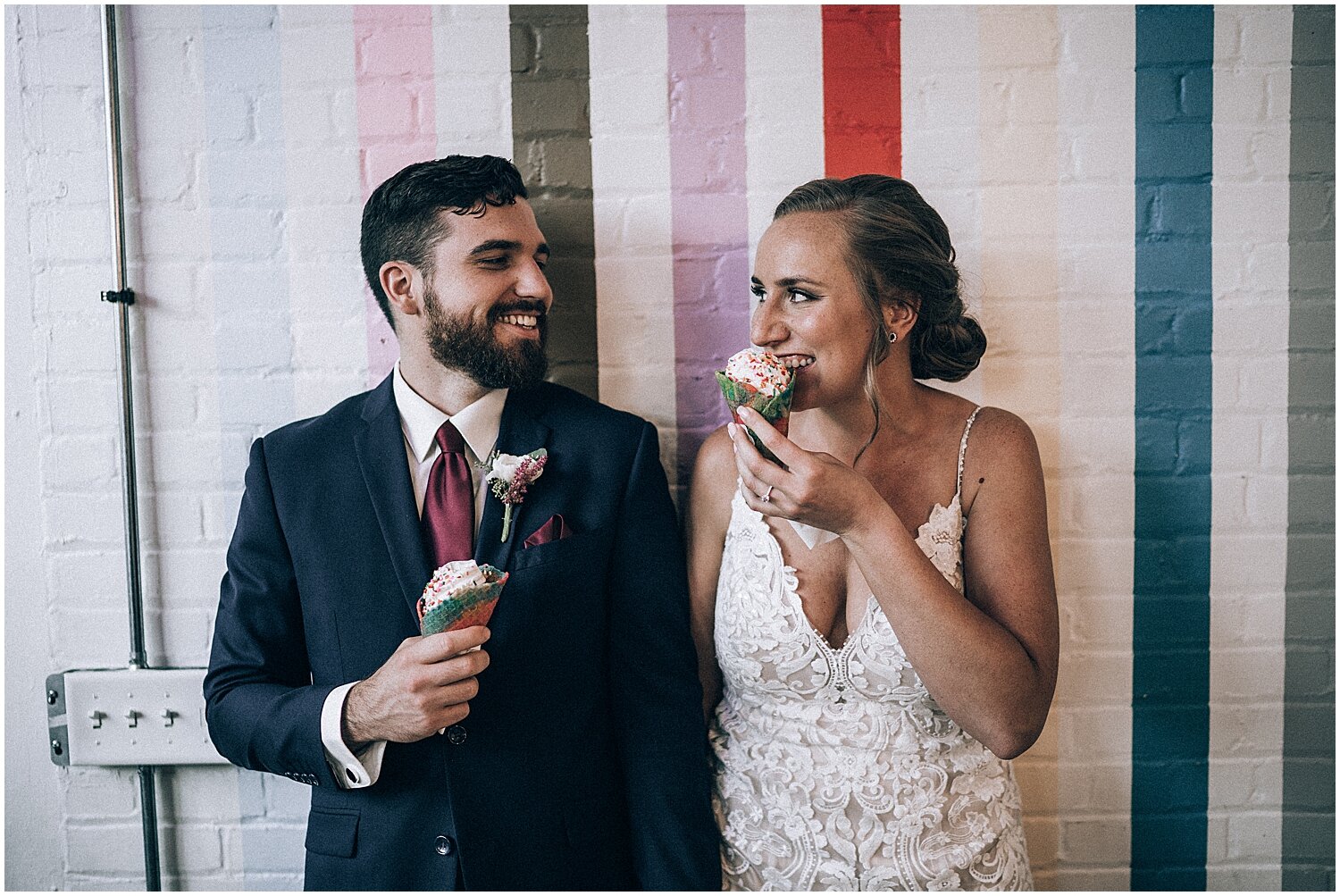  bride and groom portrait of them eating ice cream 