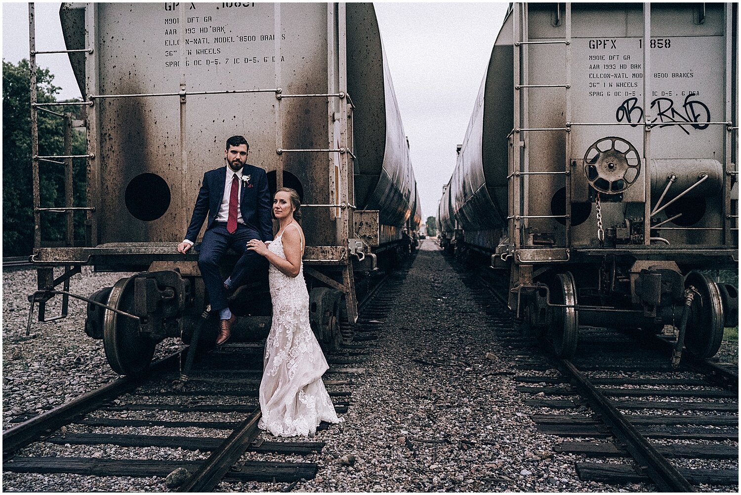  bride and groom on the train tracks 
