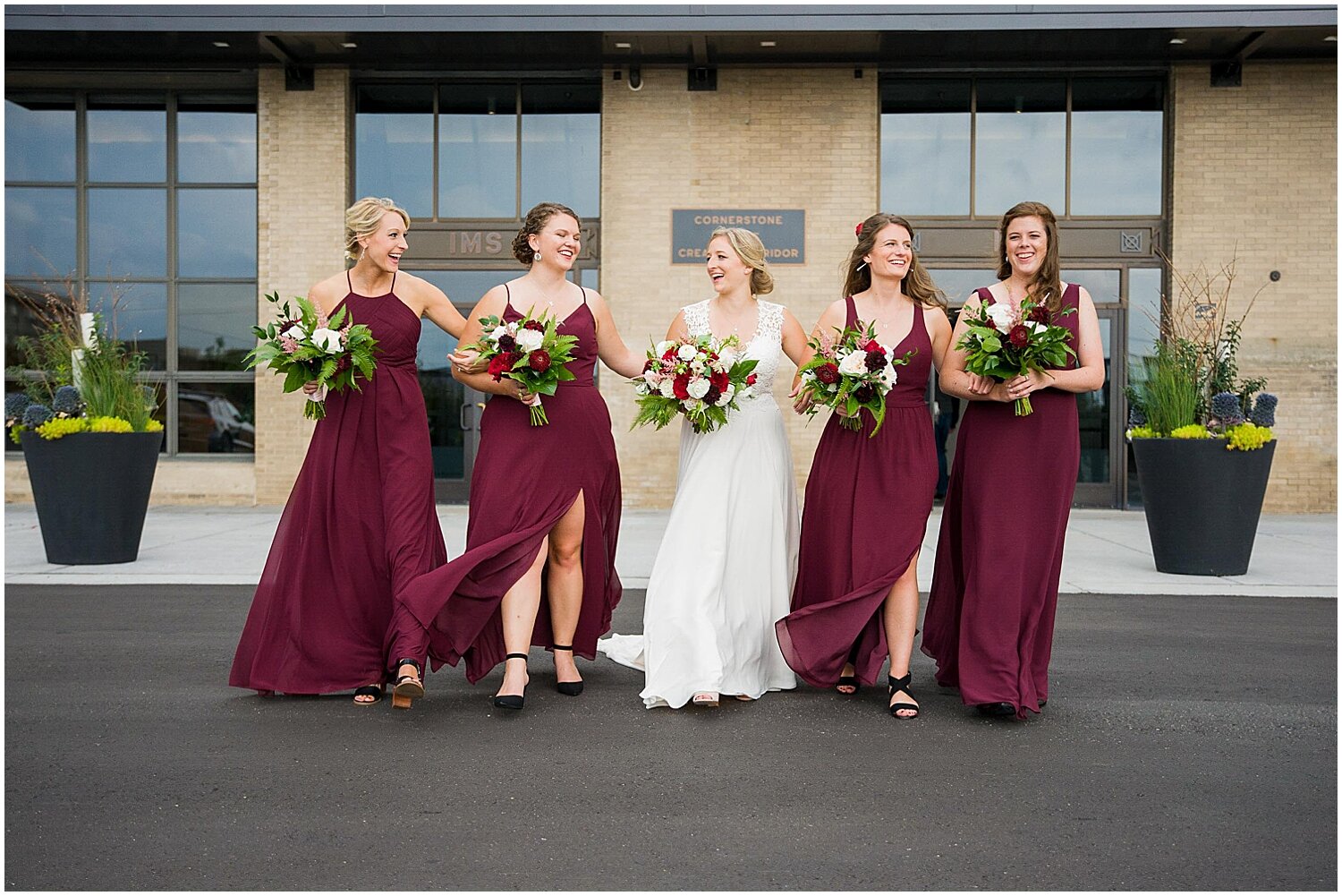  bride and bridesmaids carrying their bridal bouquets 