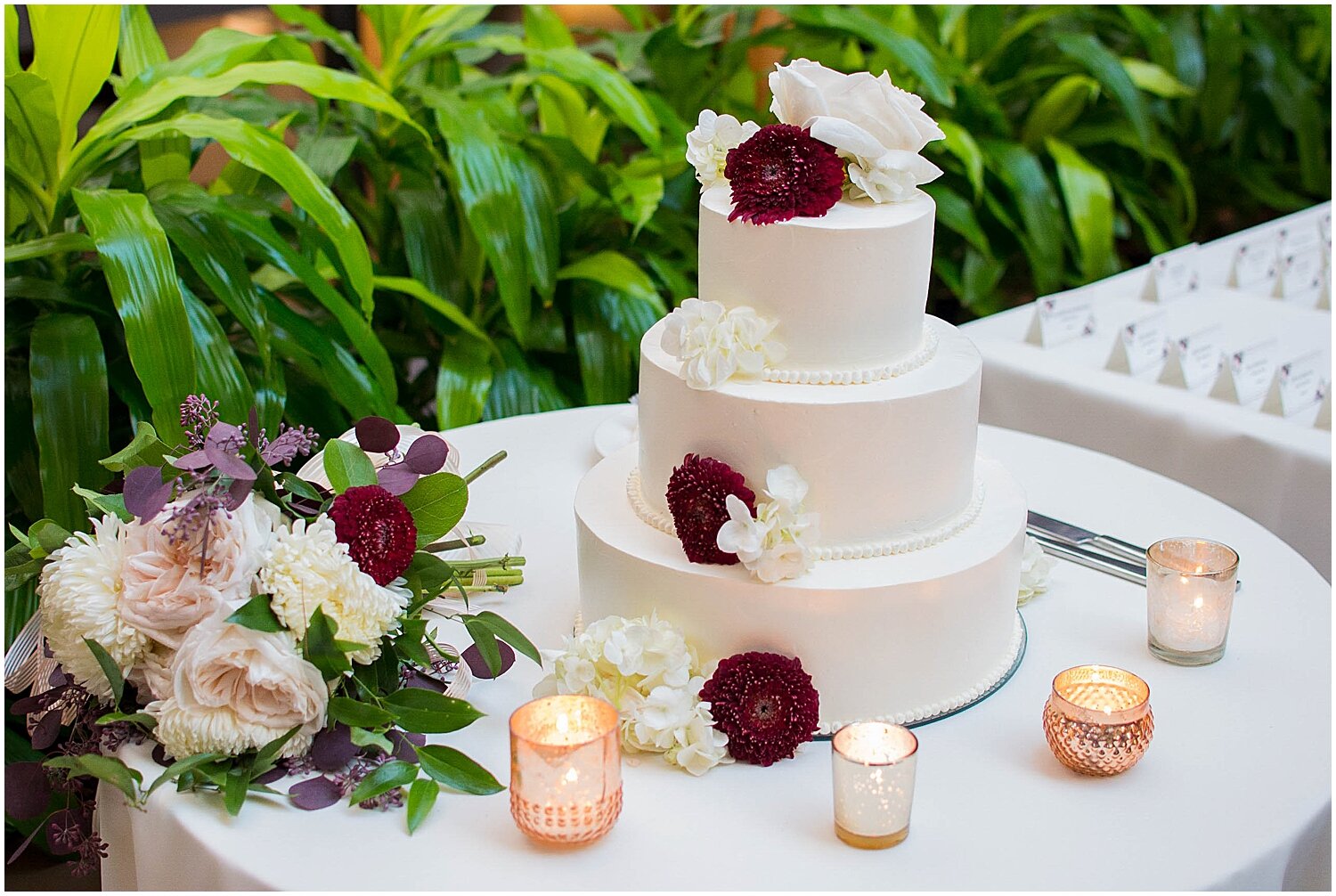  white wedding cake table display with floral decor 