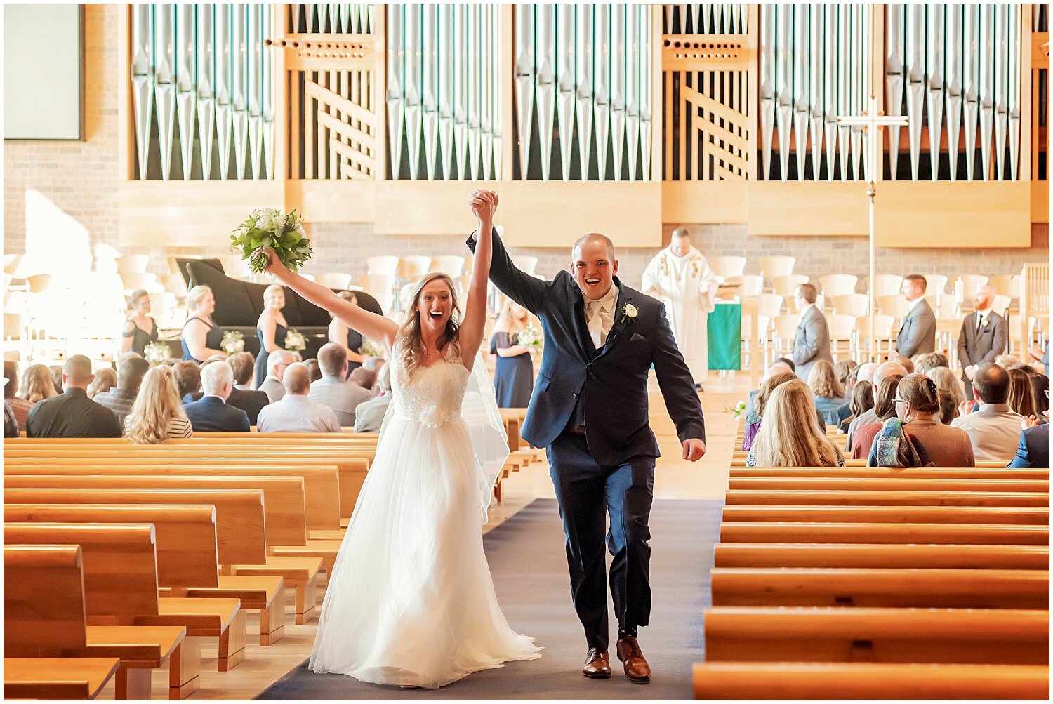  bride and groom cheer as they walk out of their wedding ceremony 