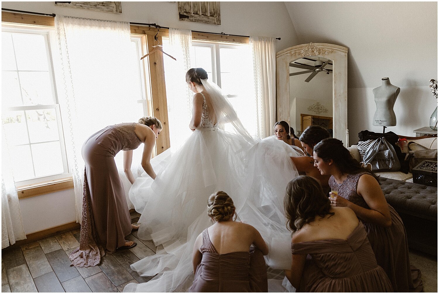  bridesmaids helping the bride get ready 
