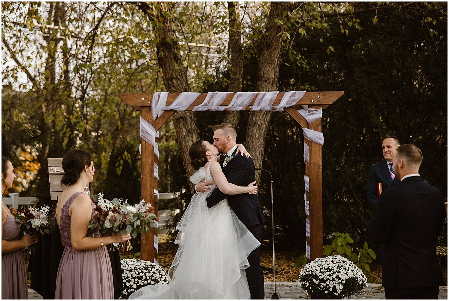  bride and groom say I do at their outdoor wedding ceremony 