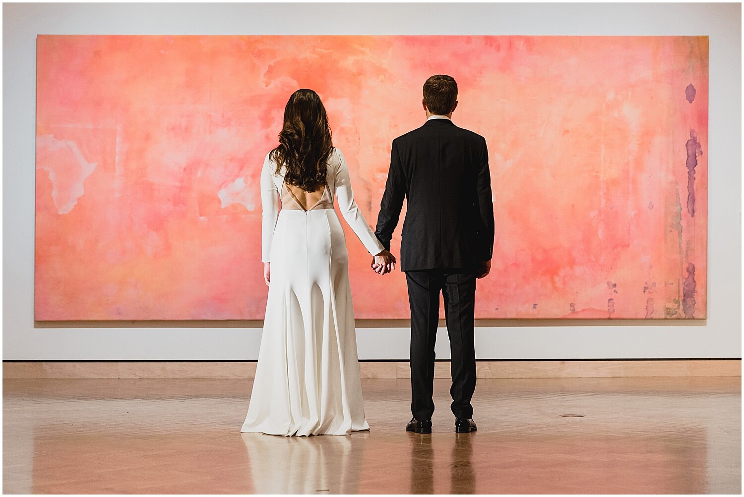  bride and groom holding hands in Minneapolis Institute of Art 