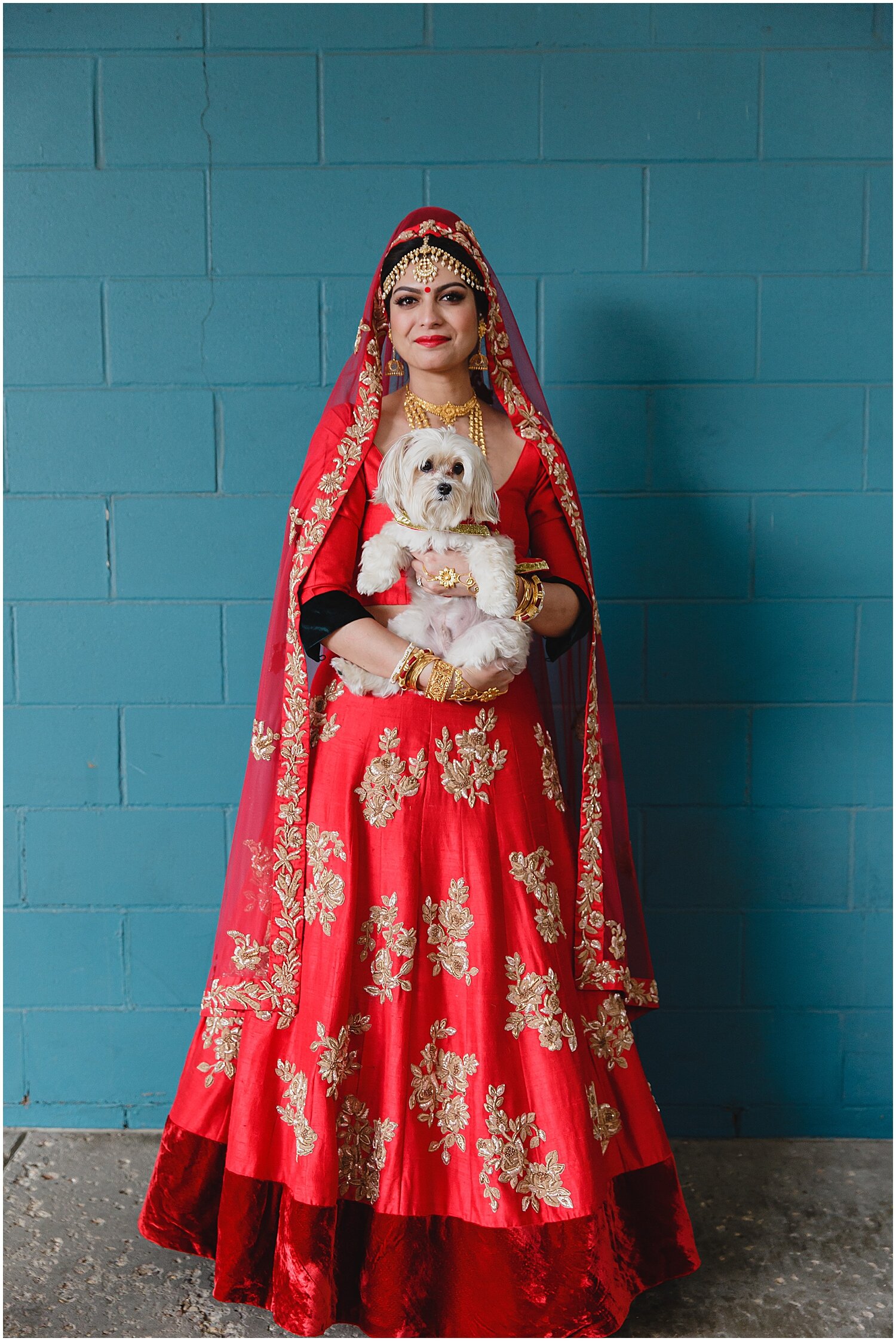  bride holding her dog before the wedding 