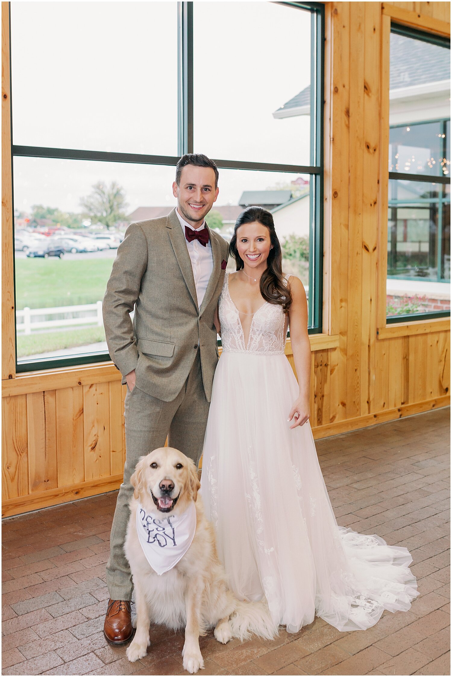  bride and groom with their dog at the wedding 