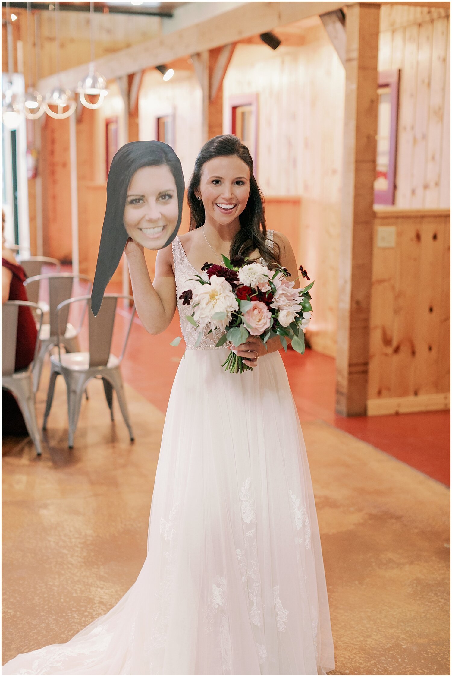  bride holding a cut up of her face 