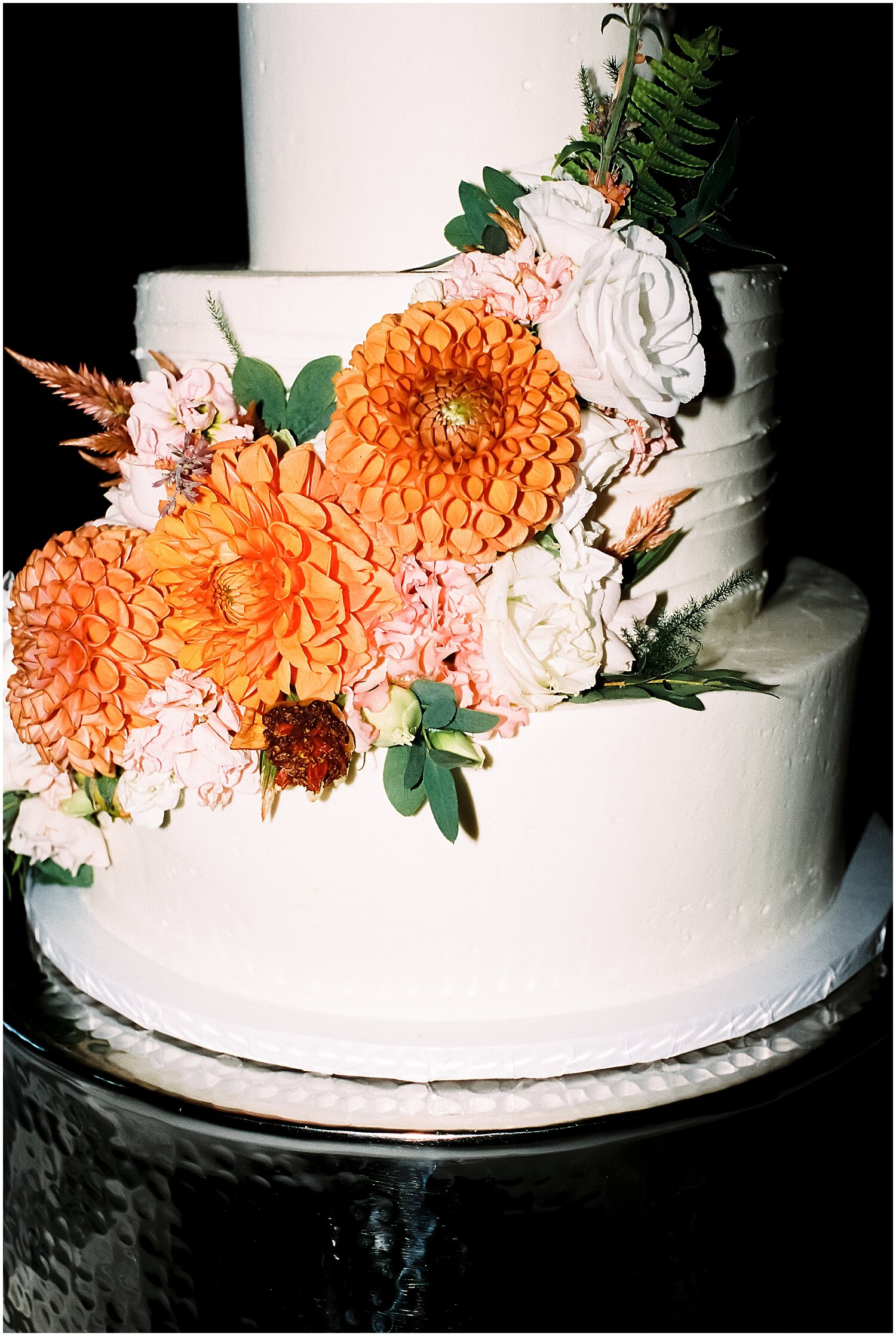  white wedding cake with floral decor 
