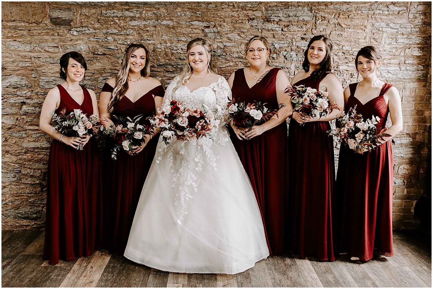  bride and bridesmaids holding their bouquets 