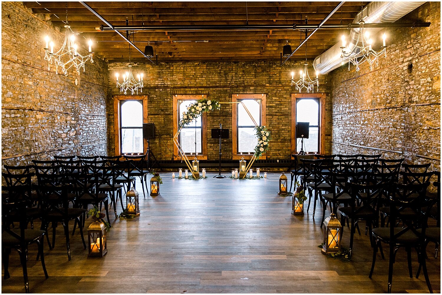  indoor wedding ceremony at Earl &amp; Wilson 