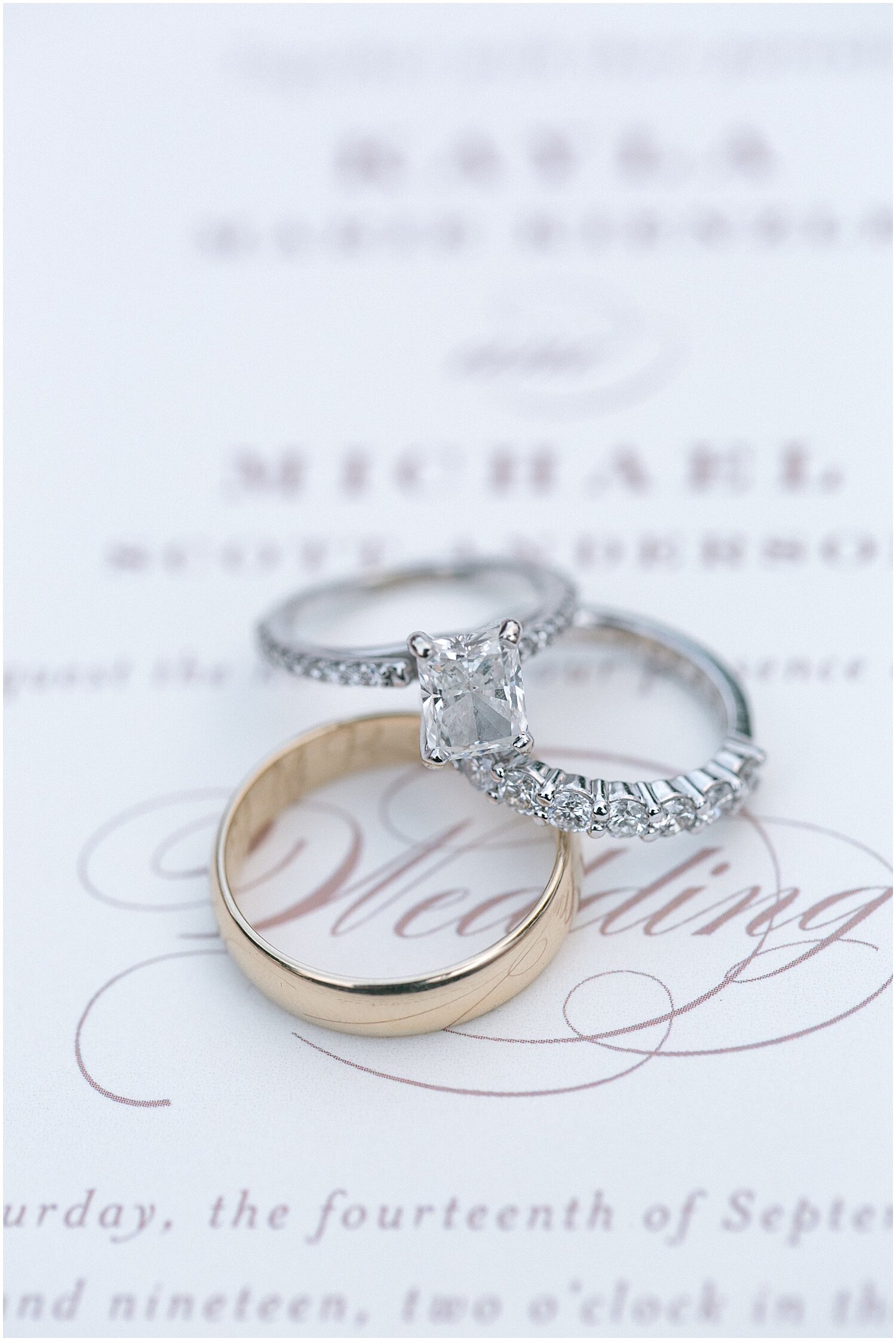  wedding rings and wedding invitation 