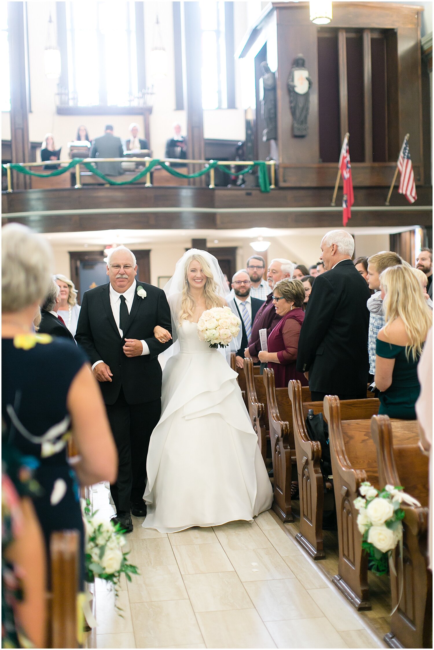  bride and her father walking down the aisle 