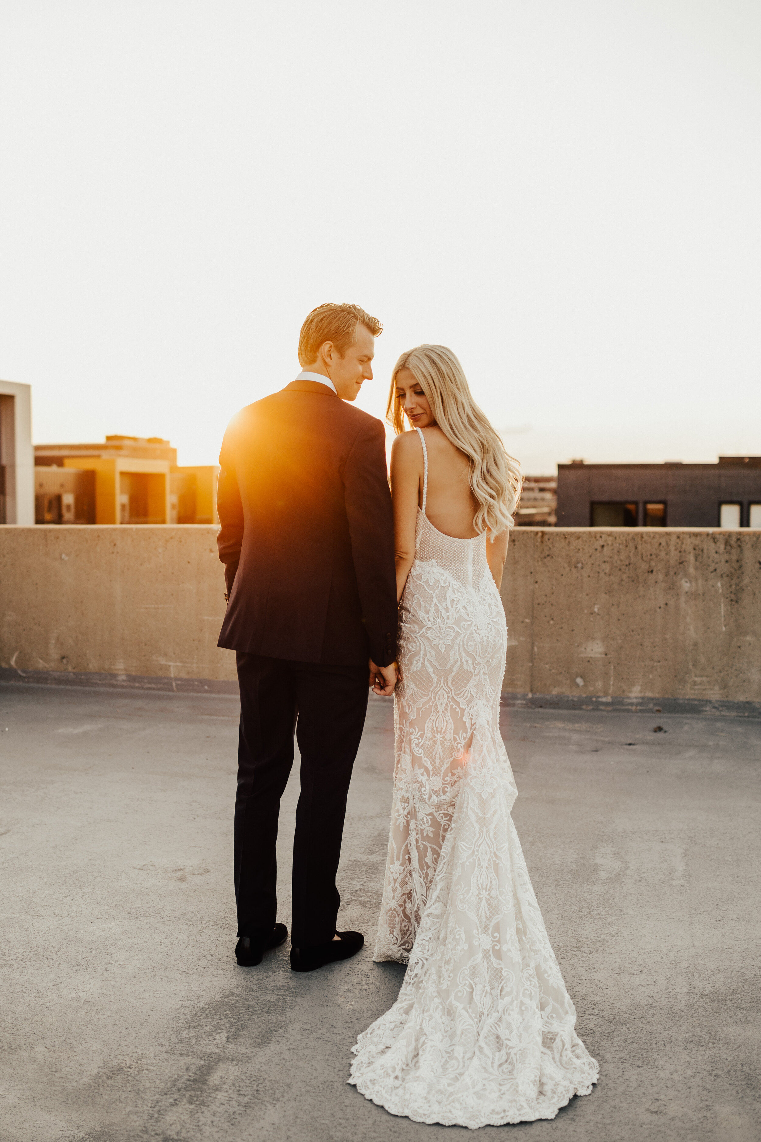  bride and groom during the sunset  