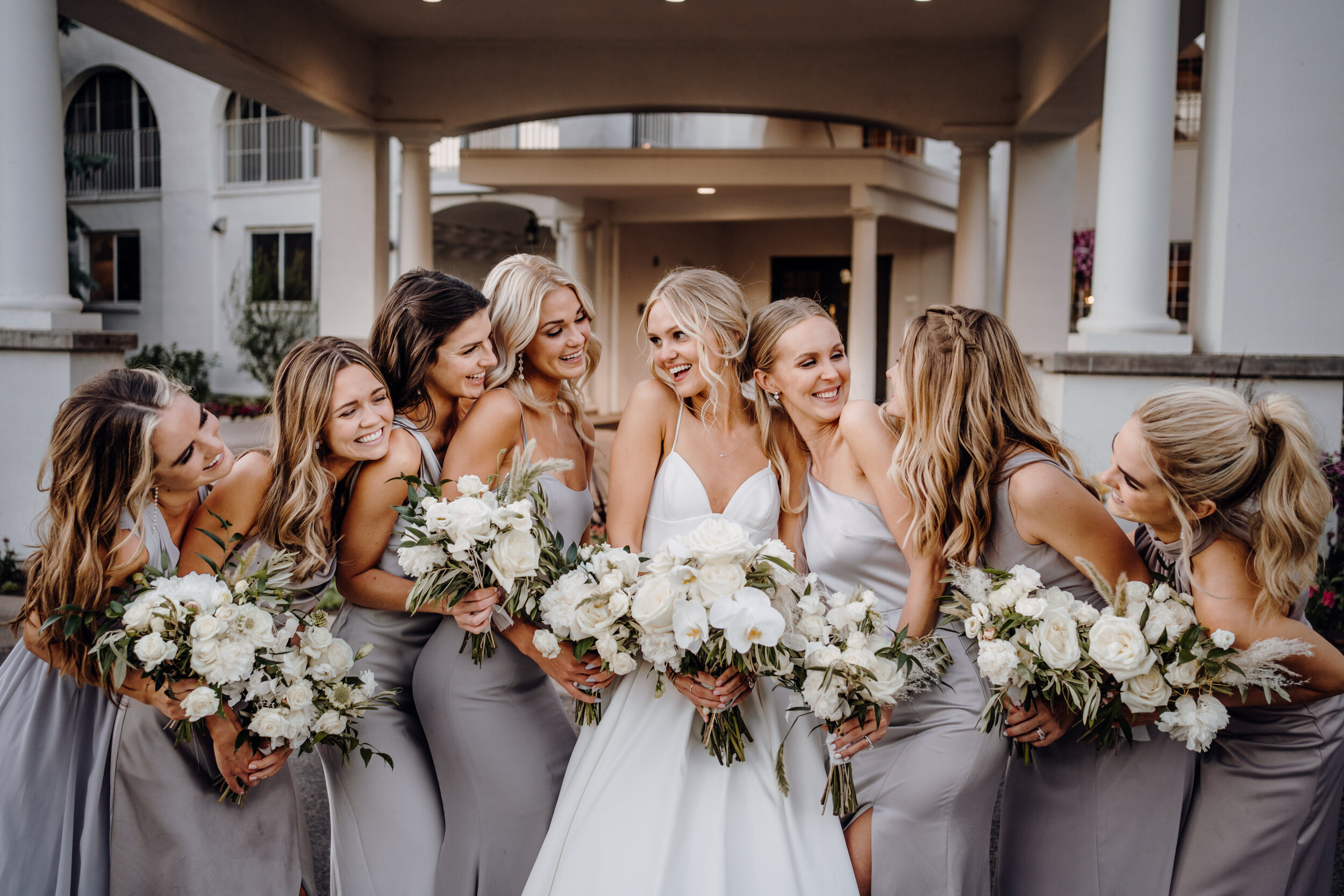  bride and bridesmaids holding their wedding bouquets 