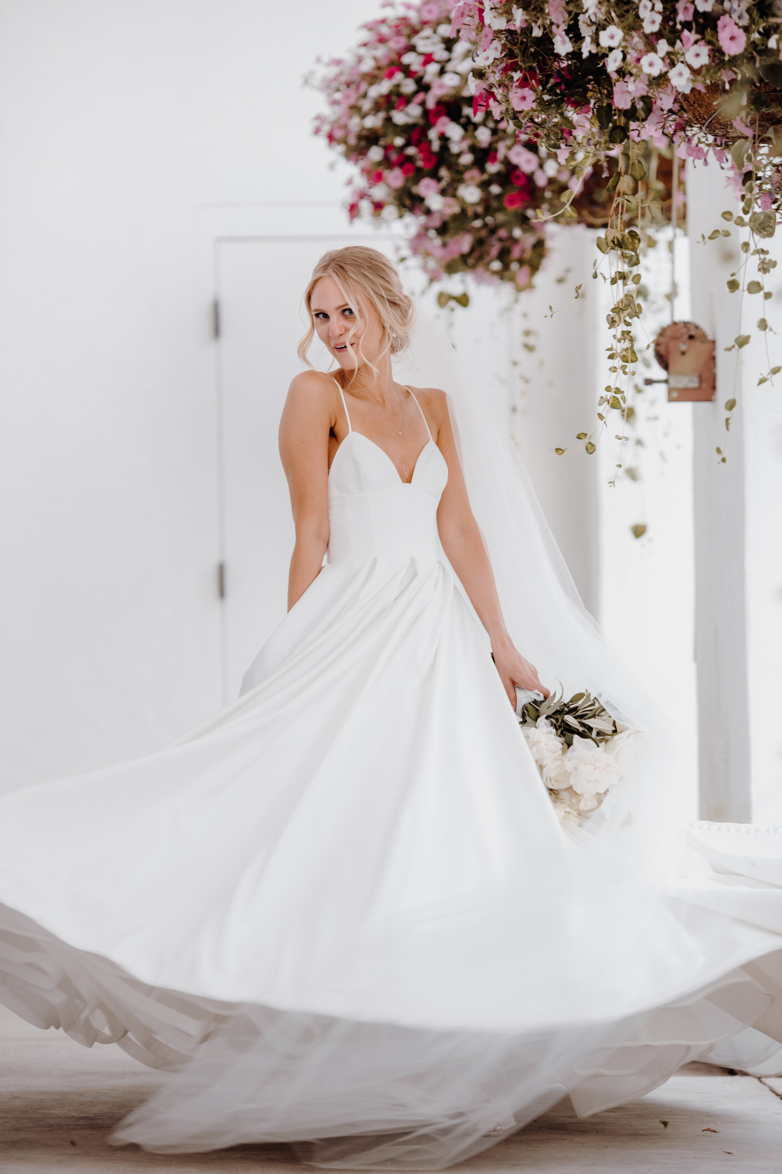  bride twirling her wedding dress 