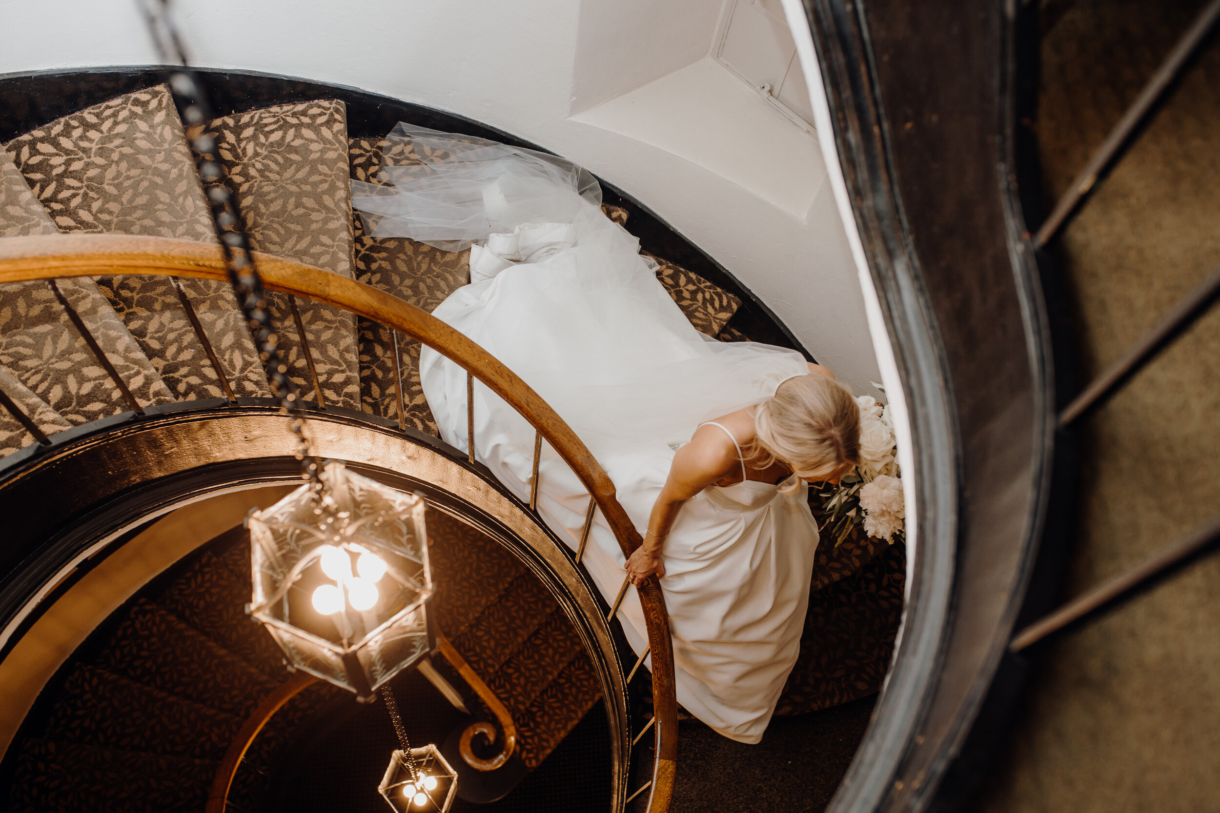  bride walking down a stairwell 