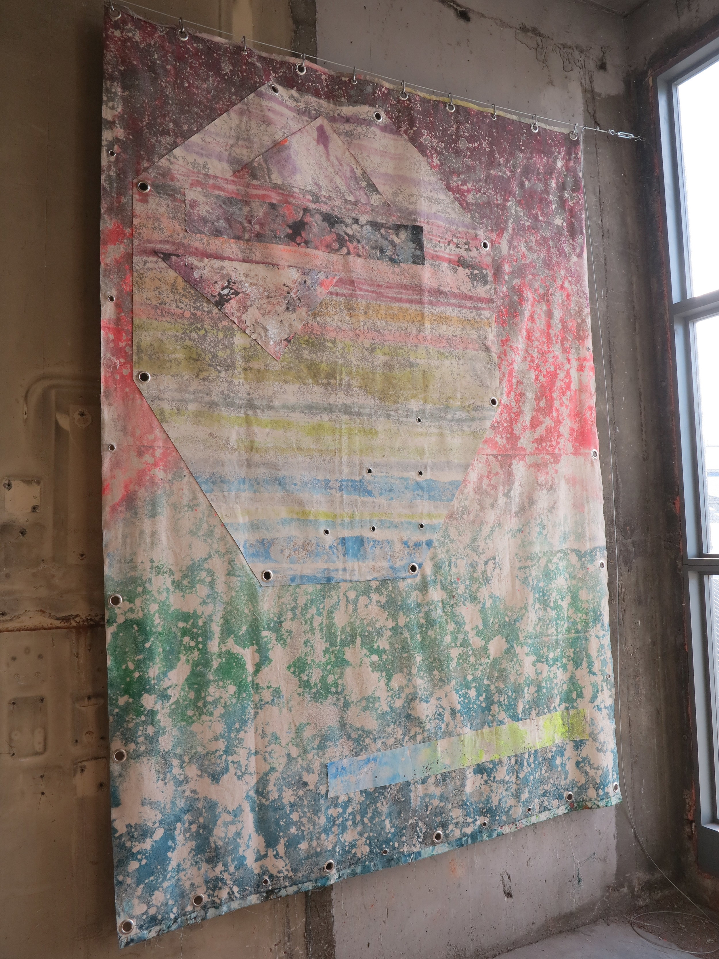   This Is Not A Love Song..   Sand, spray paint, acrylic, polyester, cotton and eyelets.  300 x 200 cm.   Low Voltage Experiments  @ The Silver Building, London 2018. 