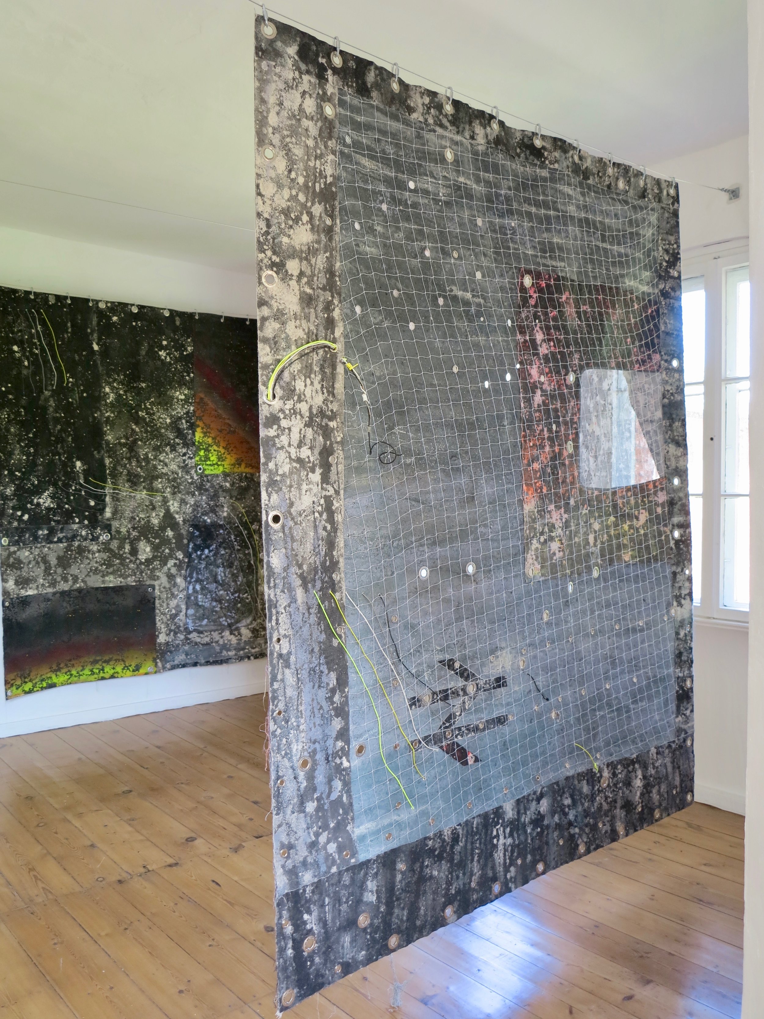   Loco Motif (B Side).   Alkyd resin, acrylic, sand, brass, rubber, polyester, polyethylene, canvas and steel.  Double sided / 266 x 213 cm.   Heterotopic Tourism  @ Lab Kalkhorst, Germany 2019. 