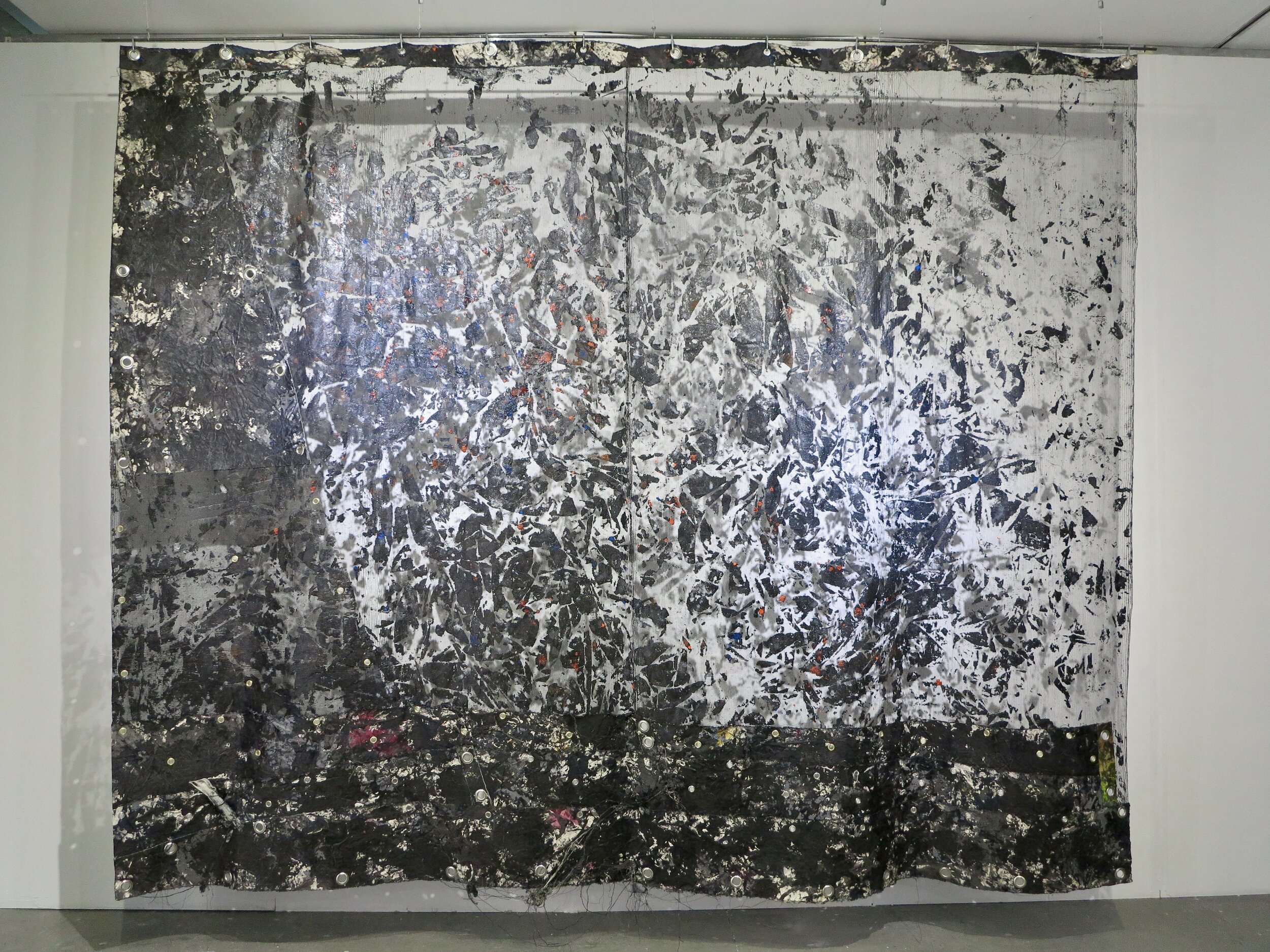   Shadow Of My Former Self.   300 x 388 cm.  Polyethylene net, canvas, acrylic, PVA, brass eyelets &amp; steel rod.   Cutting Together Apart  exhibition @ Dyson Gallery, Royal College of Art.   London 2019. 