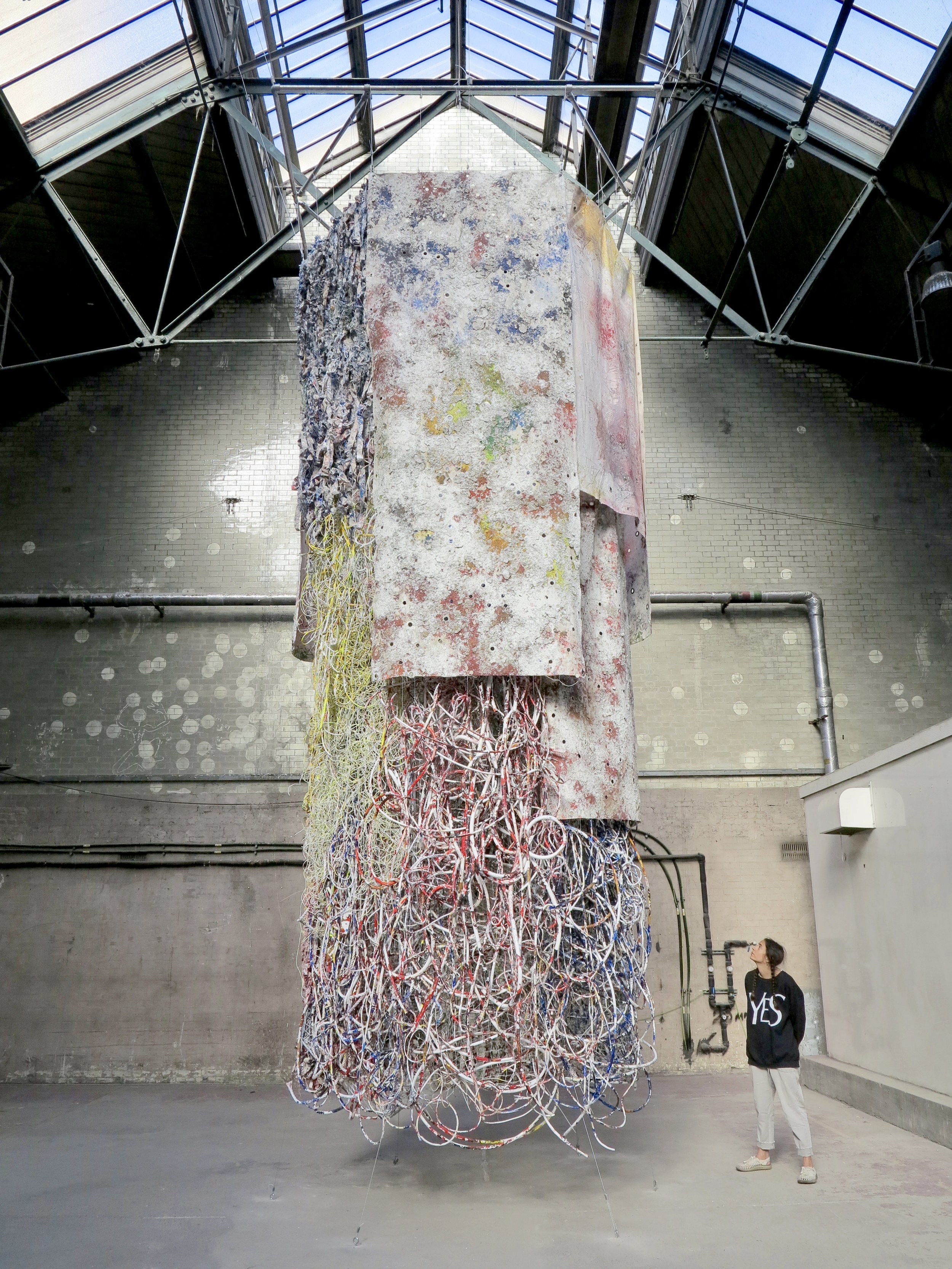   Hung Out to Dry    Gleaned electrical wires, ropes, and hand-torn ‘tagliatelle’ woven into industrial netting and hung with polymer-lichen canvas and printed debris nets  Part of the  Pigeon Park 2  exhibition, London 2022 