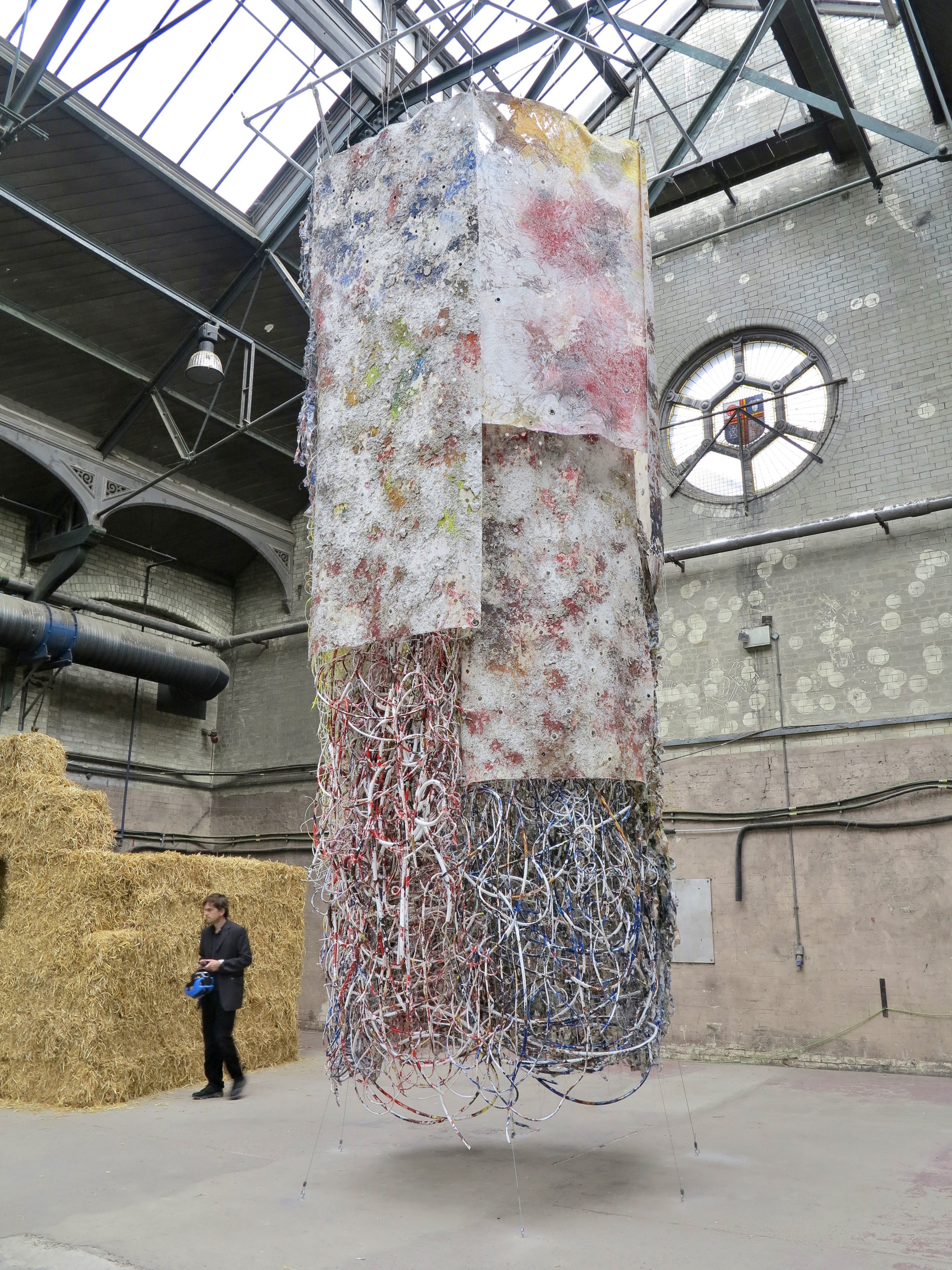   Hung Out to Dry    Gleaned electrical wires, ropes, and hand-torn ‘tagliatelle’ woven into industrial netting and hung with polymer-lichen canvas and printed debris nets  600 x 274 x 238 cm  Installed at the  Pigeon Park 2  exhibition, Manor Place,