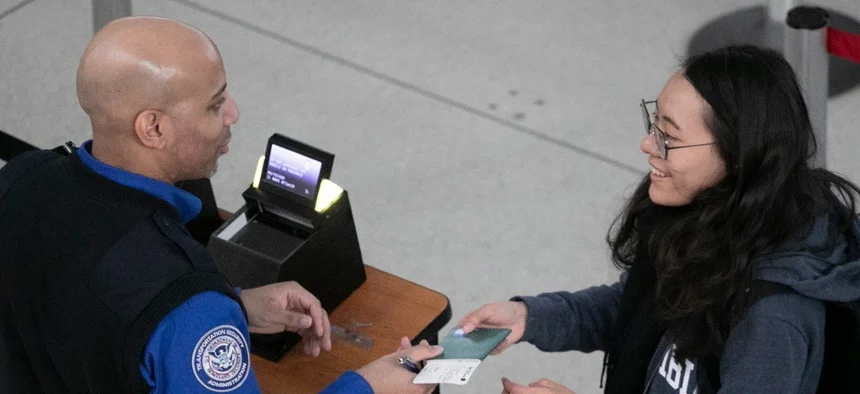 Airline passenger passing through TSA with a Real ID