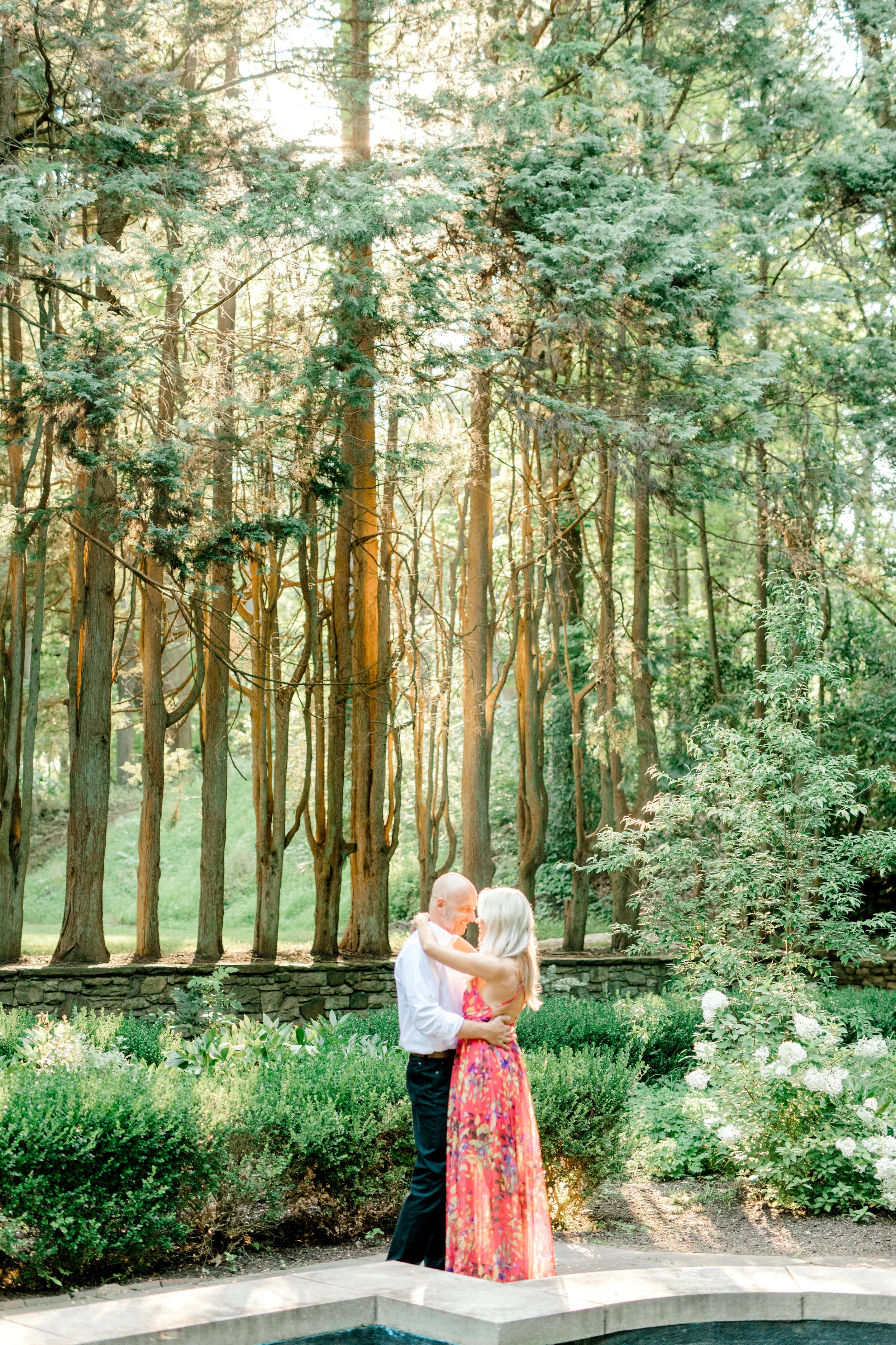 The sun was shining down on Liz and Bill for the super romantic sunset woodland engagement session at Parque at Ridley Creek.