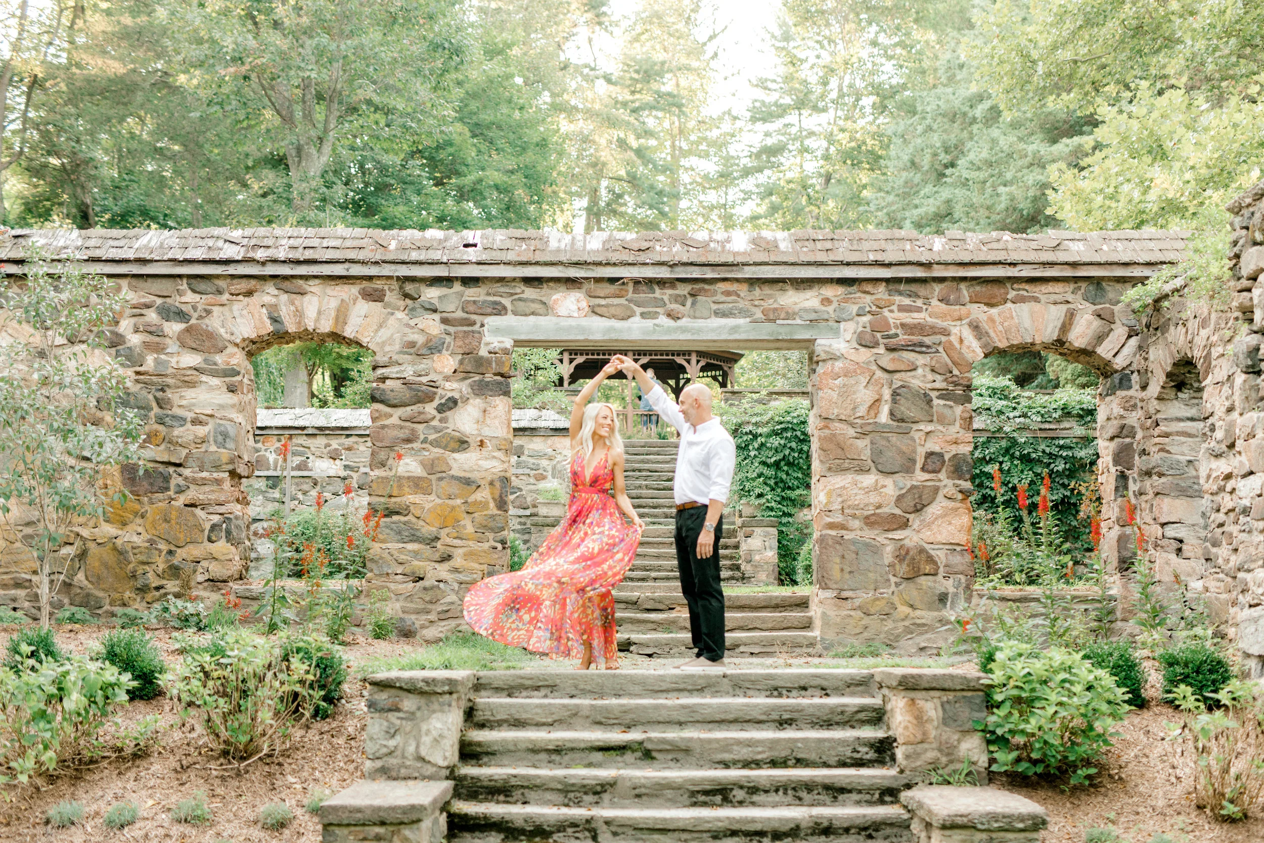 A little twirl goes a long way in keeping the romance alive, that’s why we love this moment from Liz and Bill’s romantic sunset woodland engagement session at Parque at Ridley Creek