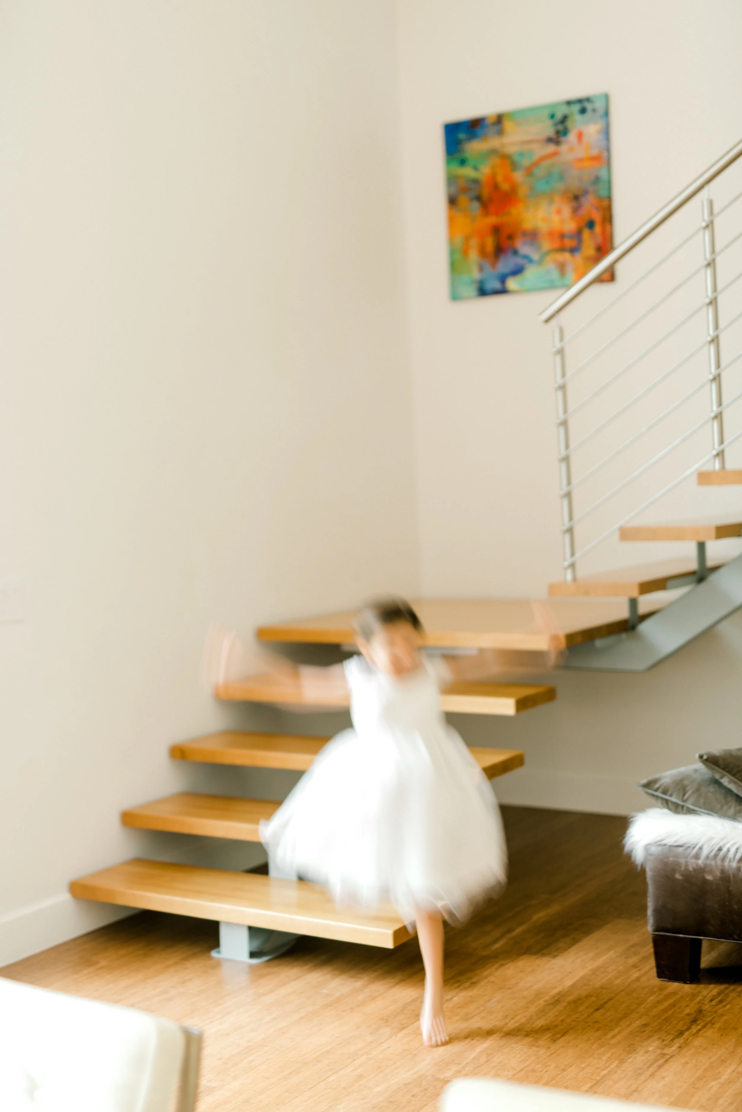 Flower girl runs around with excitement before this modern and colorful wedding at Hotel du Village.