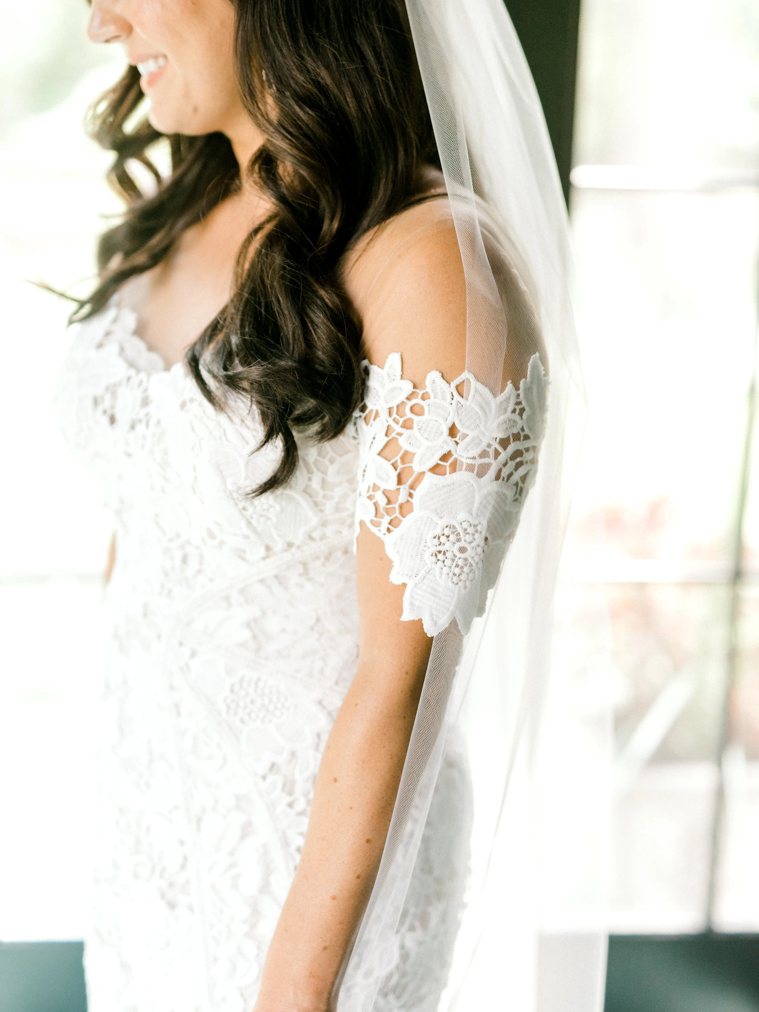 These modern lace sleeves on this Lover’s Society dress are perfect for a one-of-a-kind summer wedding.