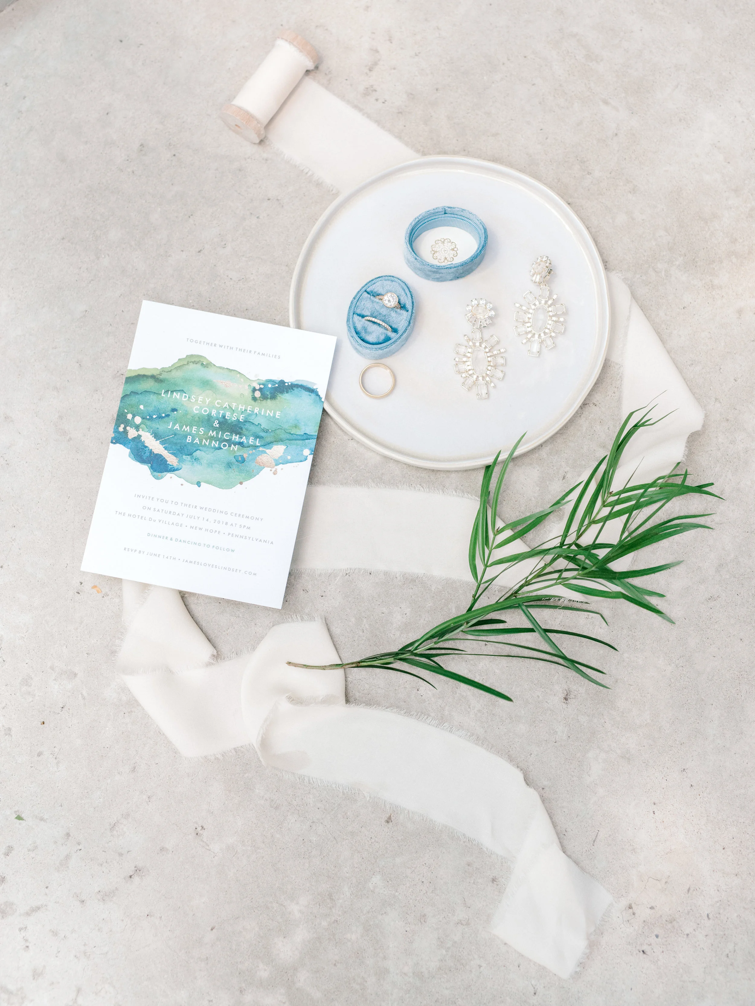 Colorful and modern summer wedding at Hotel du Village with a clean blue watercolor invitation suite.