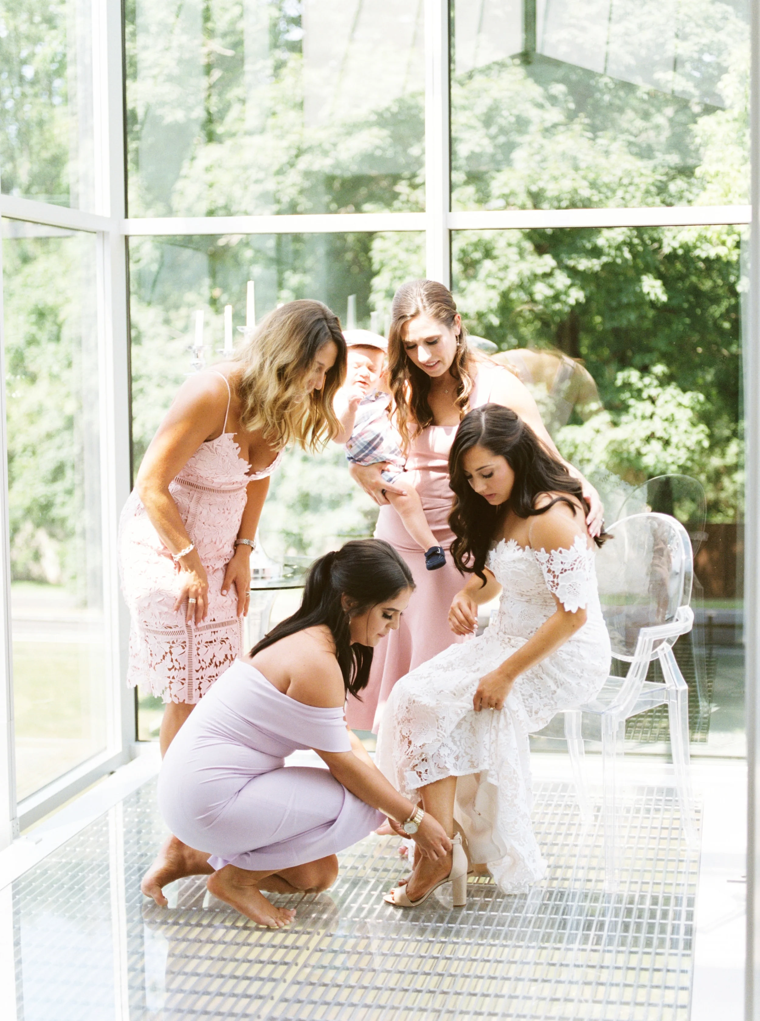 Lindsey’s girls help her get ready in this light filled AirBnB before her modern and colorful wedding day at Hotel du Village.
