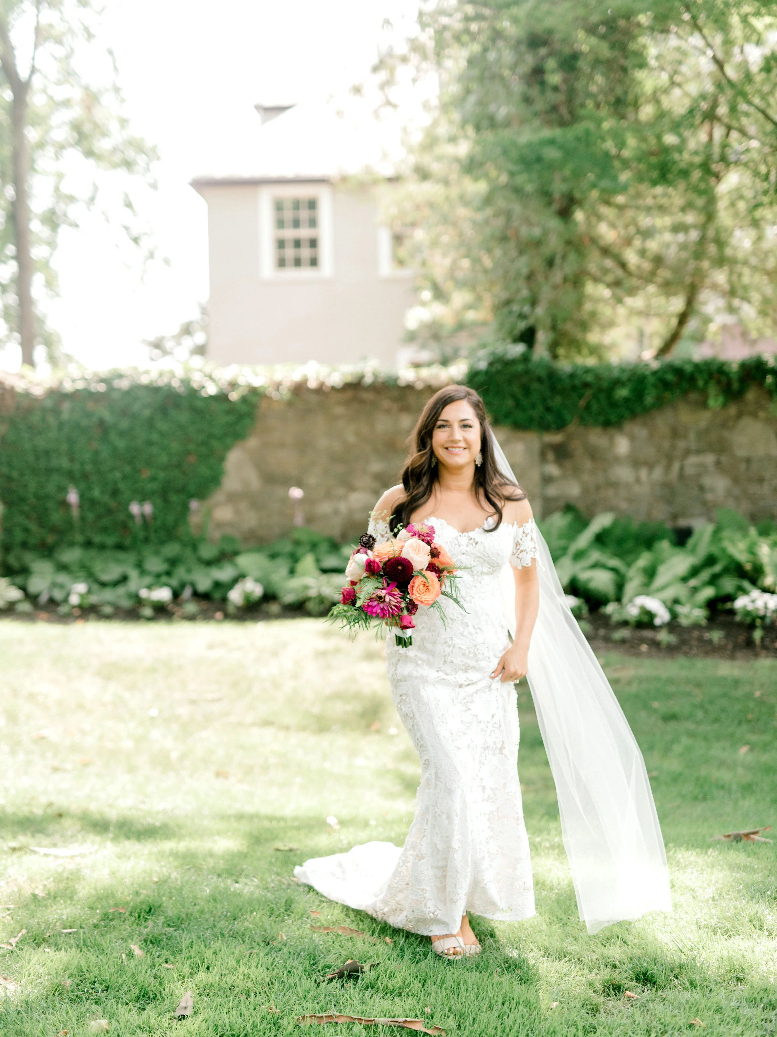 Lindsey carried a bright and colorful bouquet from The Pod Shop that paired so well with her classic Lover’s Society lace gown for her modern sunny summer wedding at Hotel du Village.