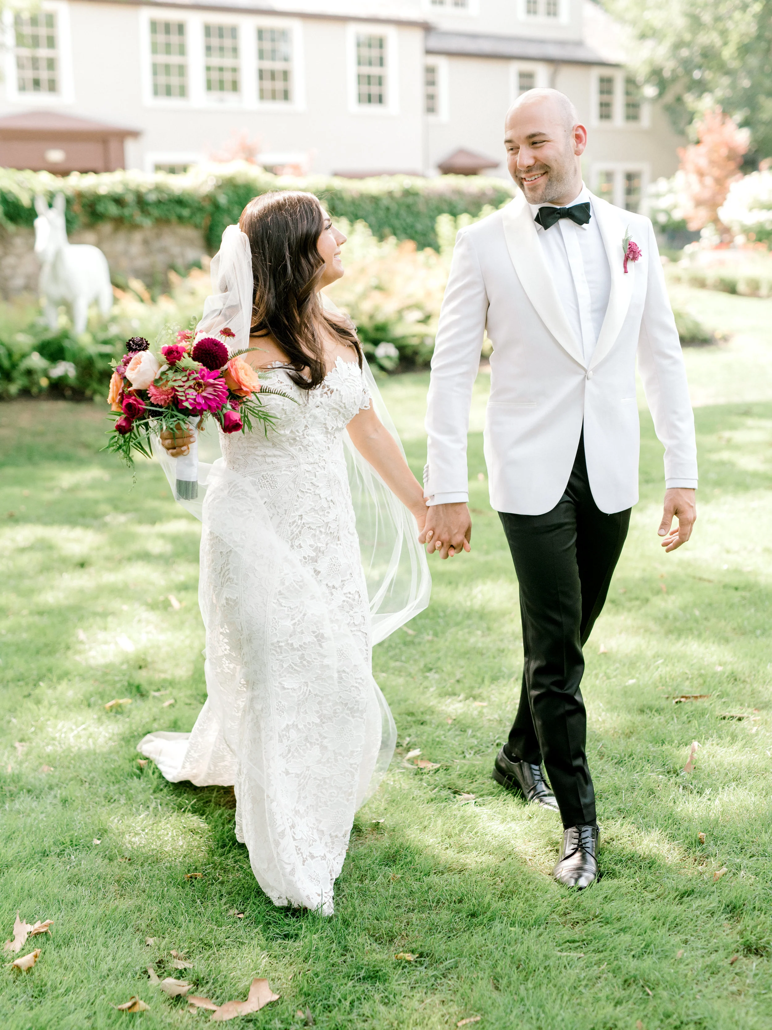 We loved the bright and modern look of whites mixed with bold pops of color for Lindsey and James’s summer wedding at Hotel du Village.