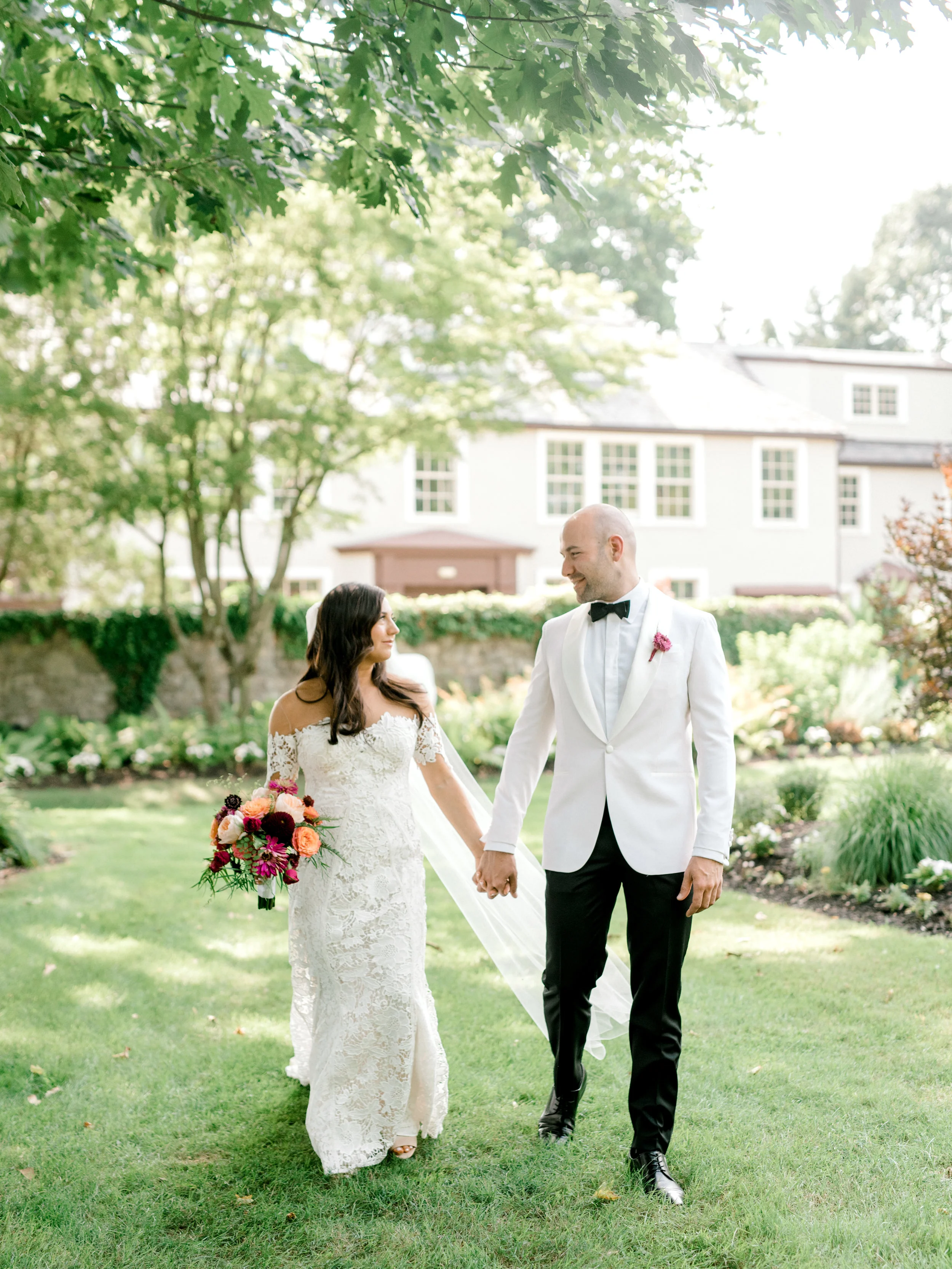 We loved the bright and modern look of whites mixed with bold pops of color for Lindsey and James’s summer wedding at Hotel du Village.