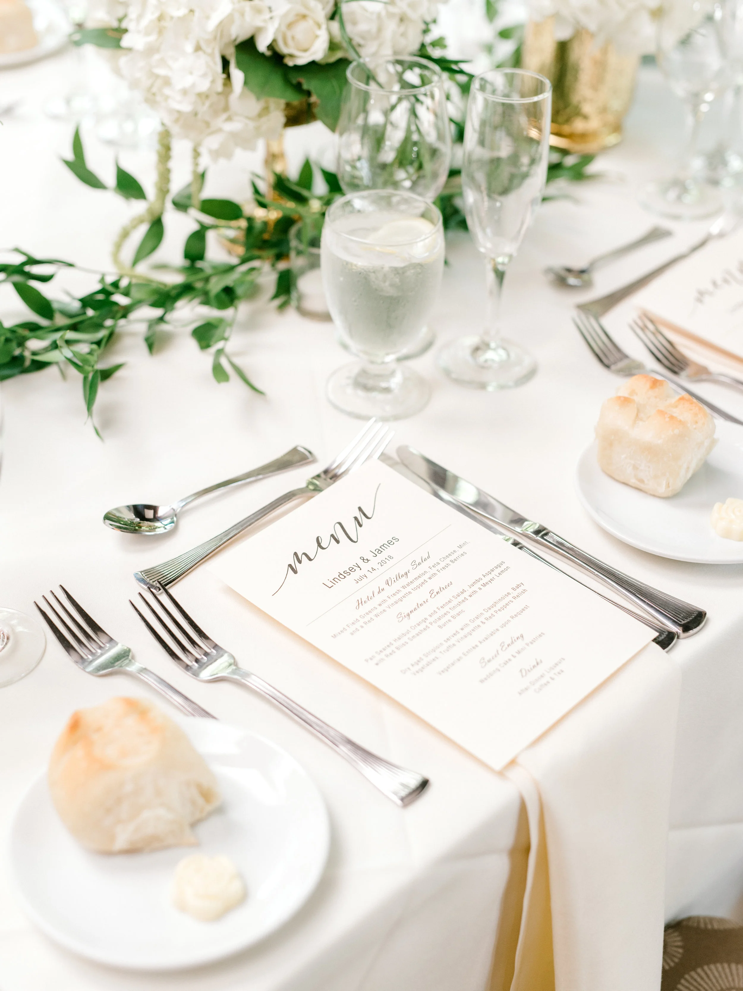 An elegant white and green table setting adds a touch of opulence to this bright and modern summer wedding at Hotel du Village.