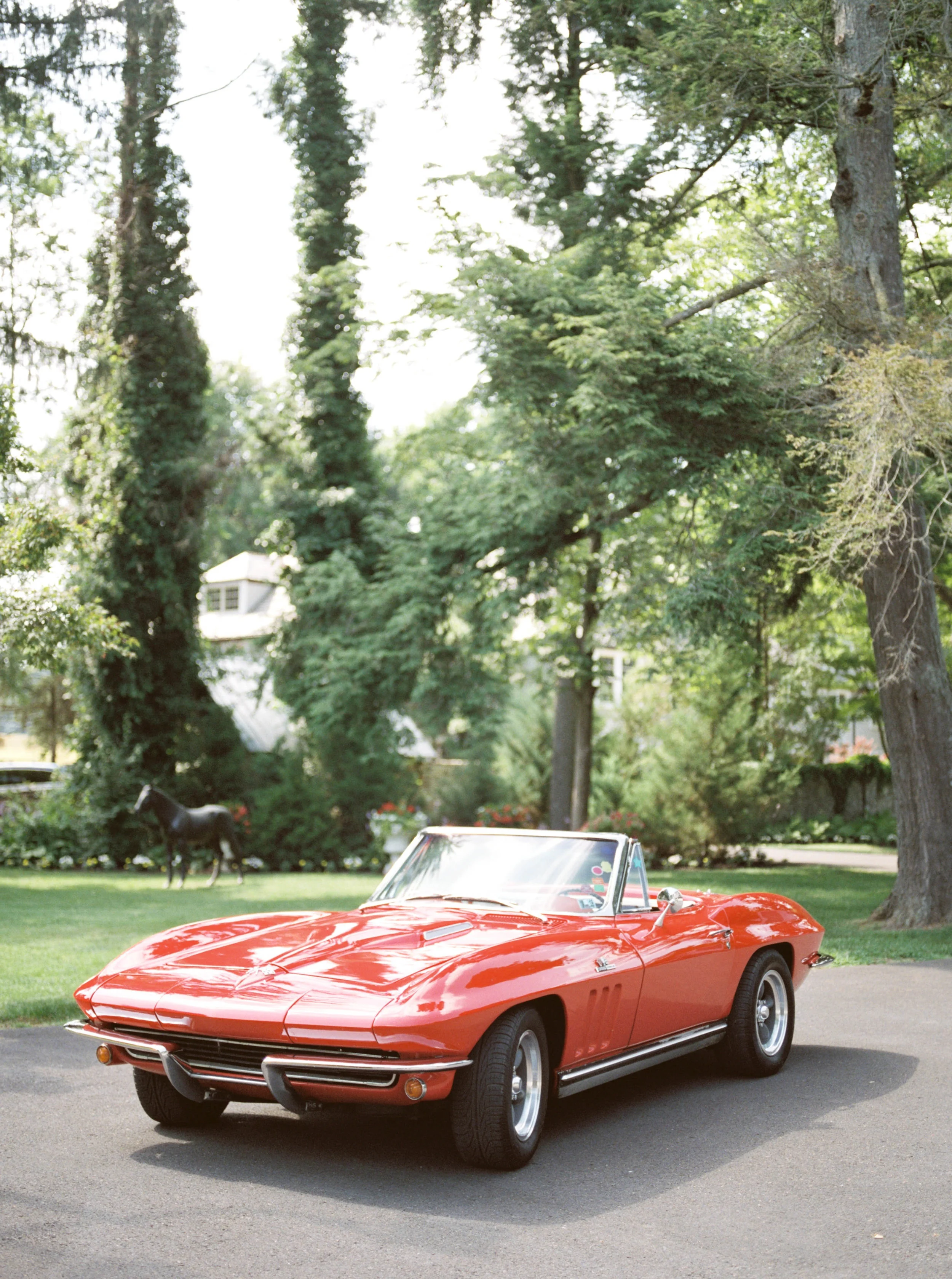 We love a classic car on a wedding day and this red hot rod fit the bill for Lindsey and James’s colorful and modern wedding day at Hotel du Village.