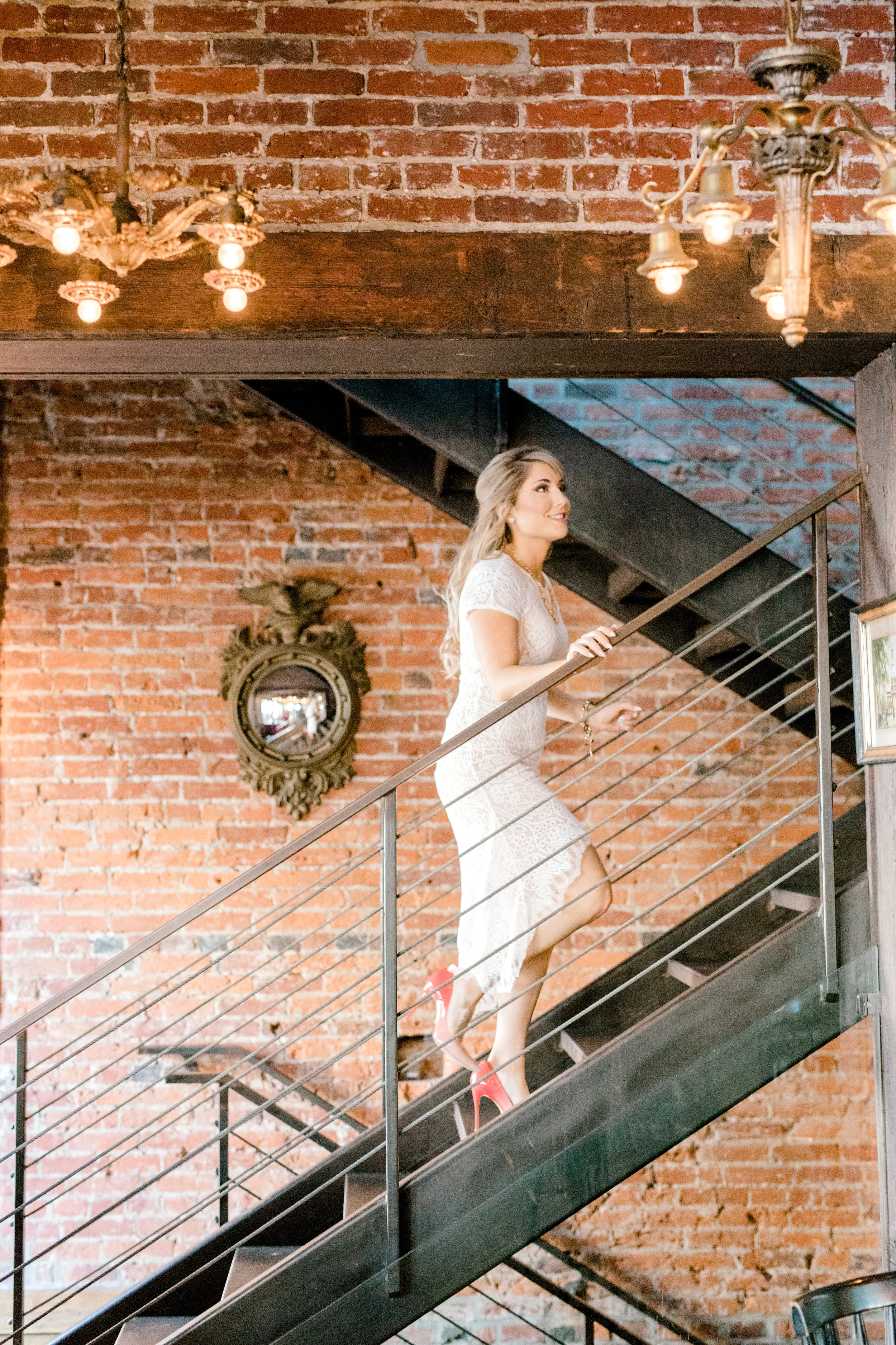 Nikki heads up the stairs in this industrial pub in Old City, Philadelphia for their fall engagement session.