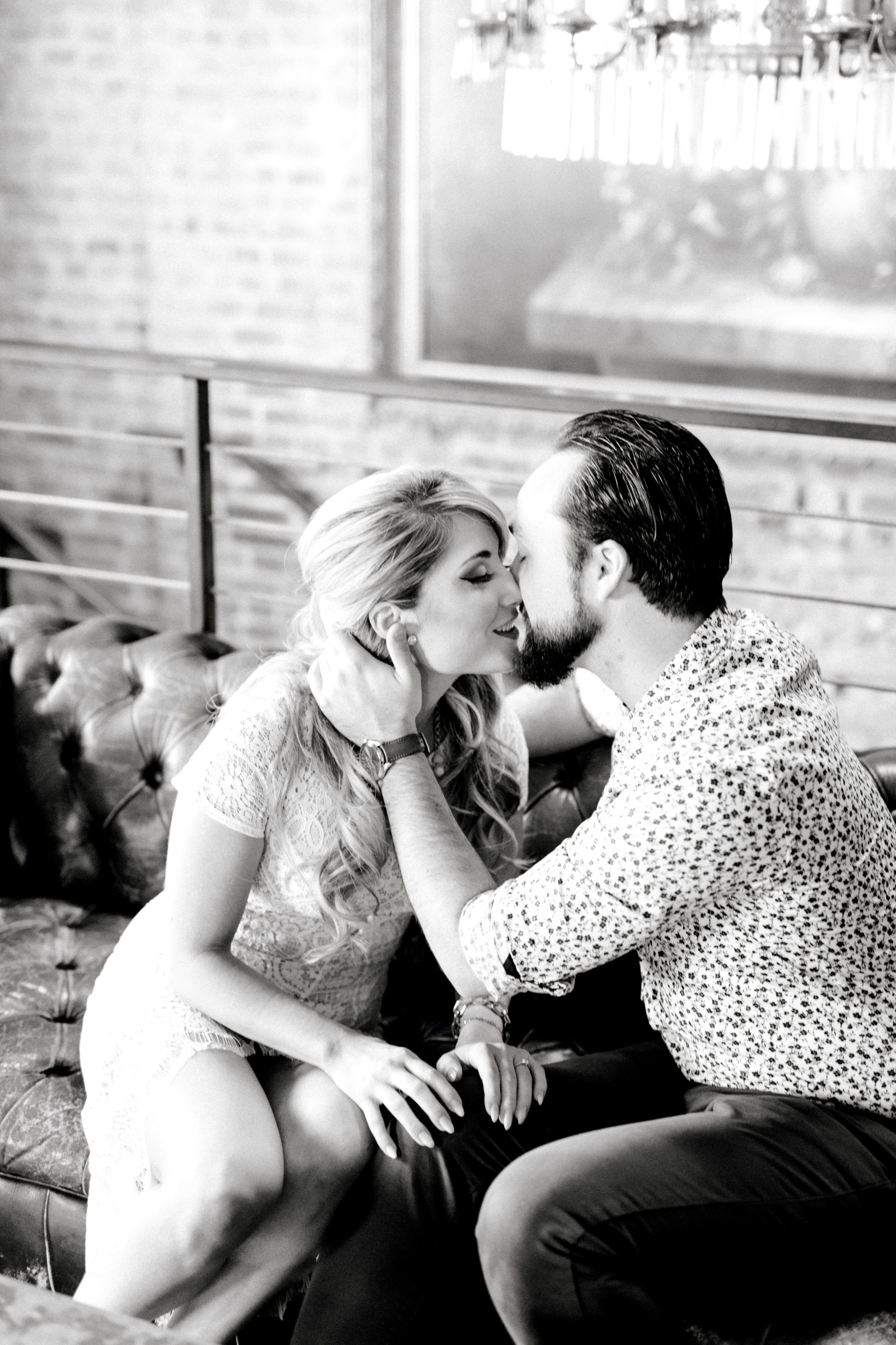 Cozied up on the couch for their romantic fall engagement session at the Revolution House in Old City, Philadelphia.