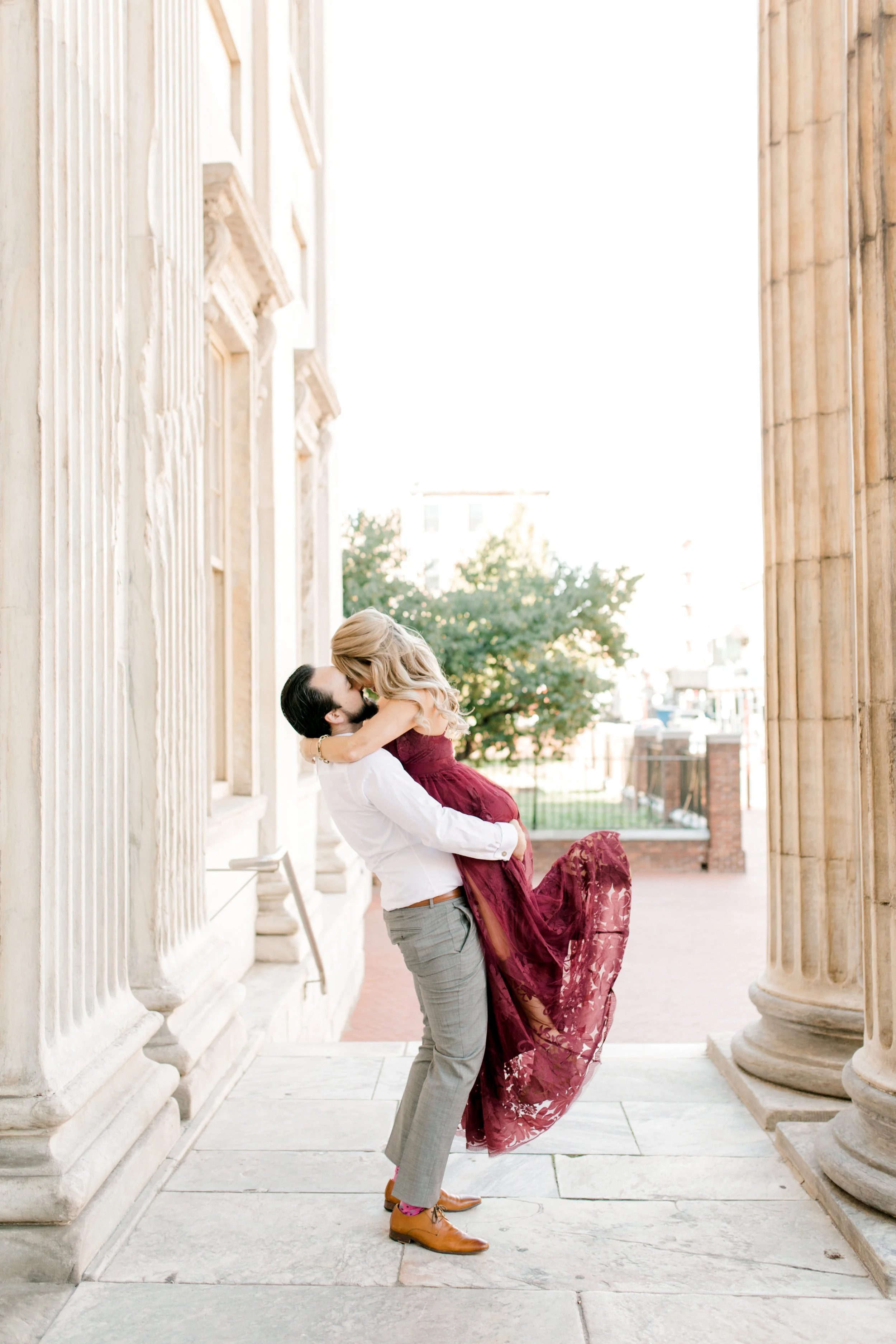 A romantic gesture, Dale lifts Nikki in the air for their bright fall engagement session in Old City, Philadelphia.
