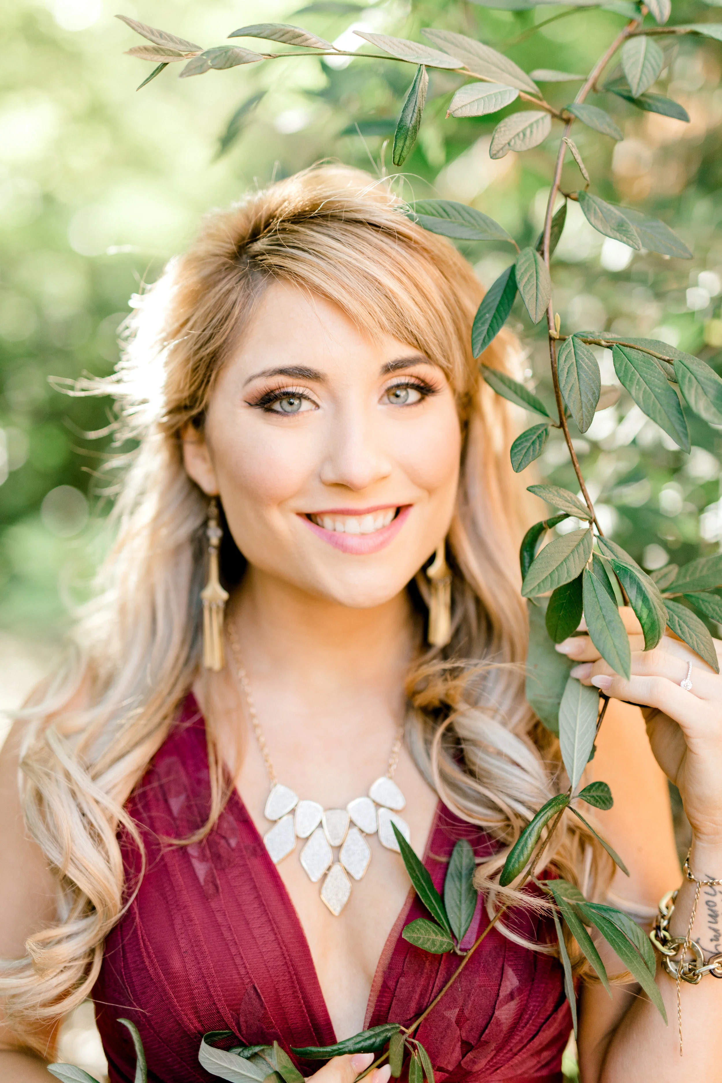 Nikki looked like perfect with her half-up hair and bold jewelry for her bright and romantic fall burgundy engagement session in Old City, Philadelphia.