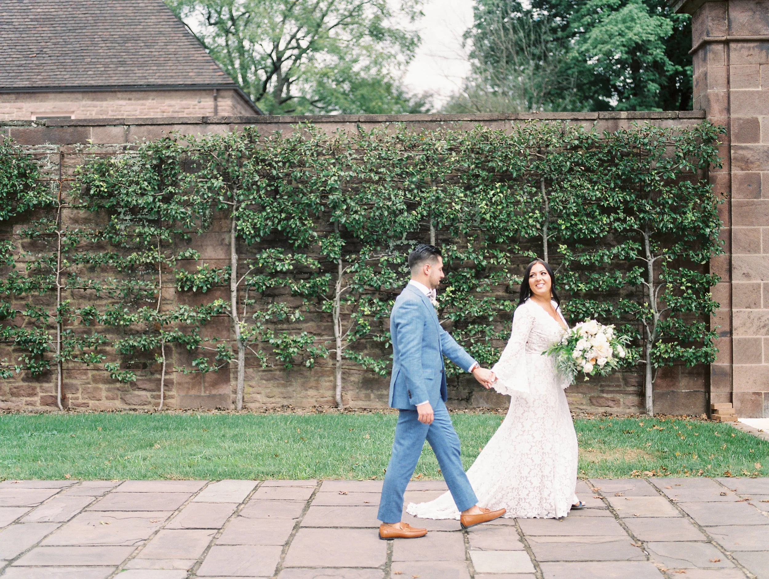 Walk with me, Alicia leads Mike into their bright boho chic Tyler Gardens wedding in Bucks County